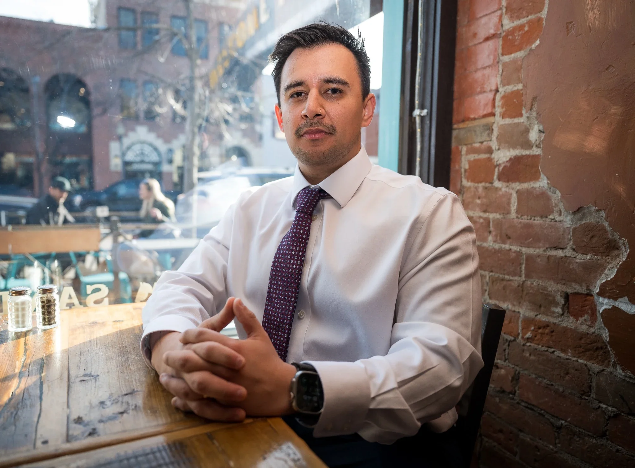 Refined, natural business headshot in Windy Saddle Cafe in Golden Colorado.