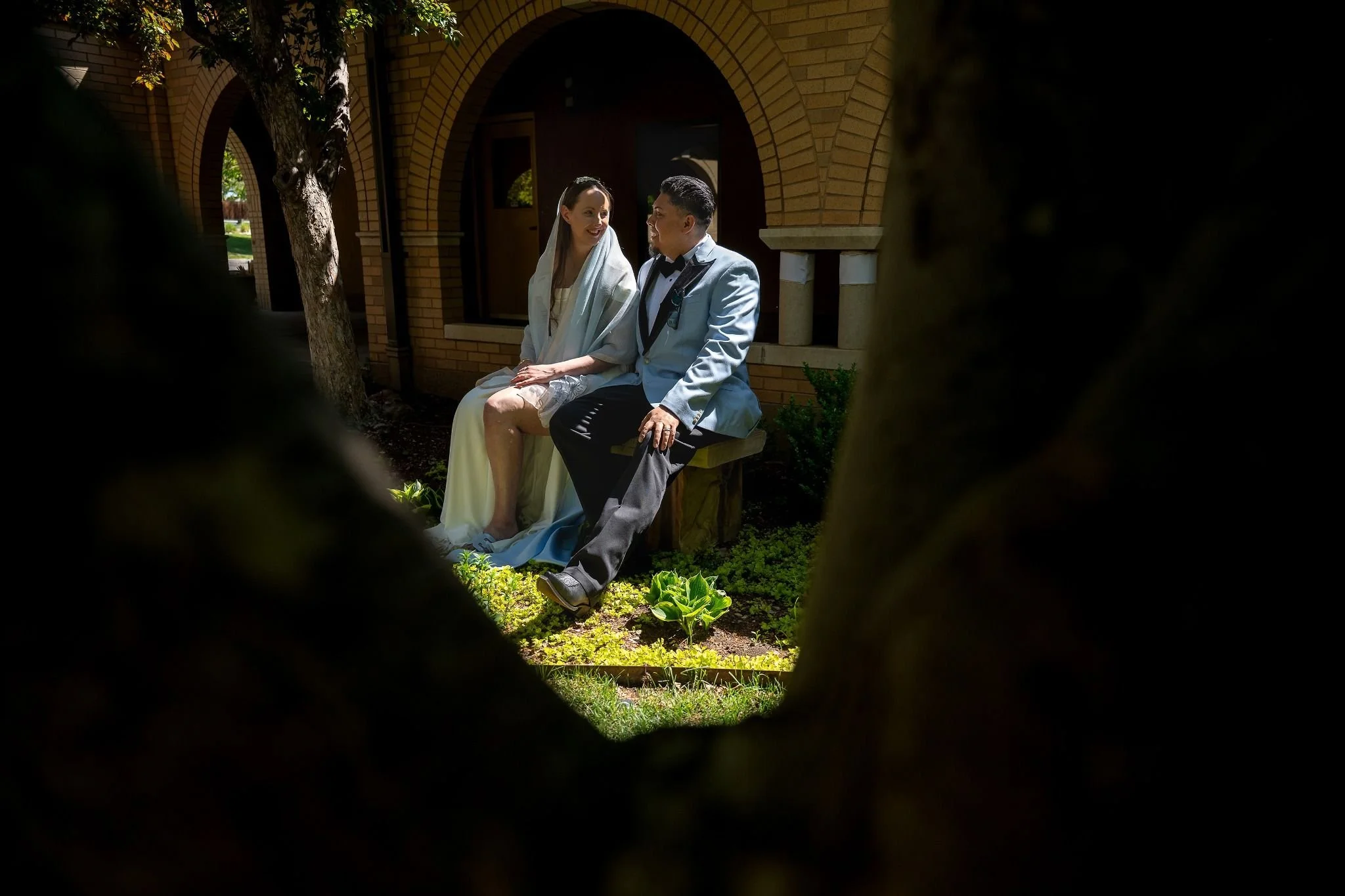 Moody and magical elopement photography in a sacred church setting—raw emotion and timeless love artfully preserved by Ryan Kost.