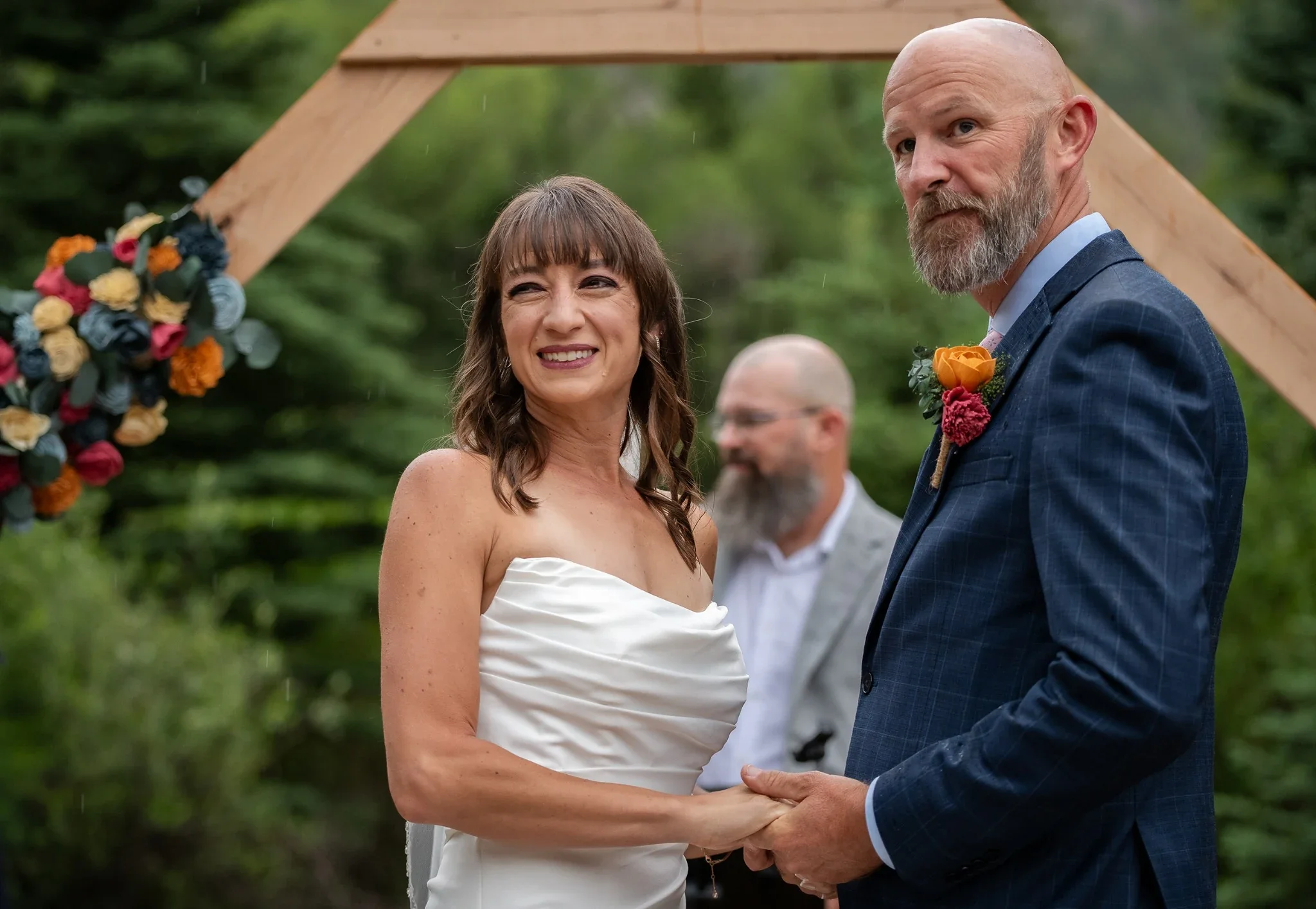 Bride and Groom show love to all of their friends and family during their ceremony at Spectacle Lake Campground in Horca, Colorado.