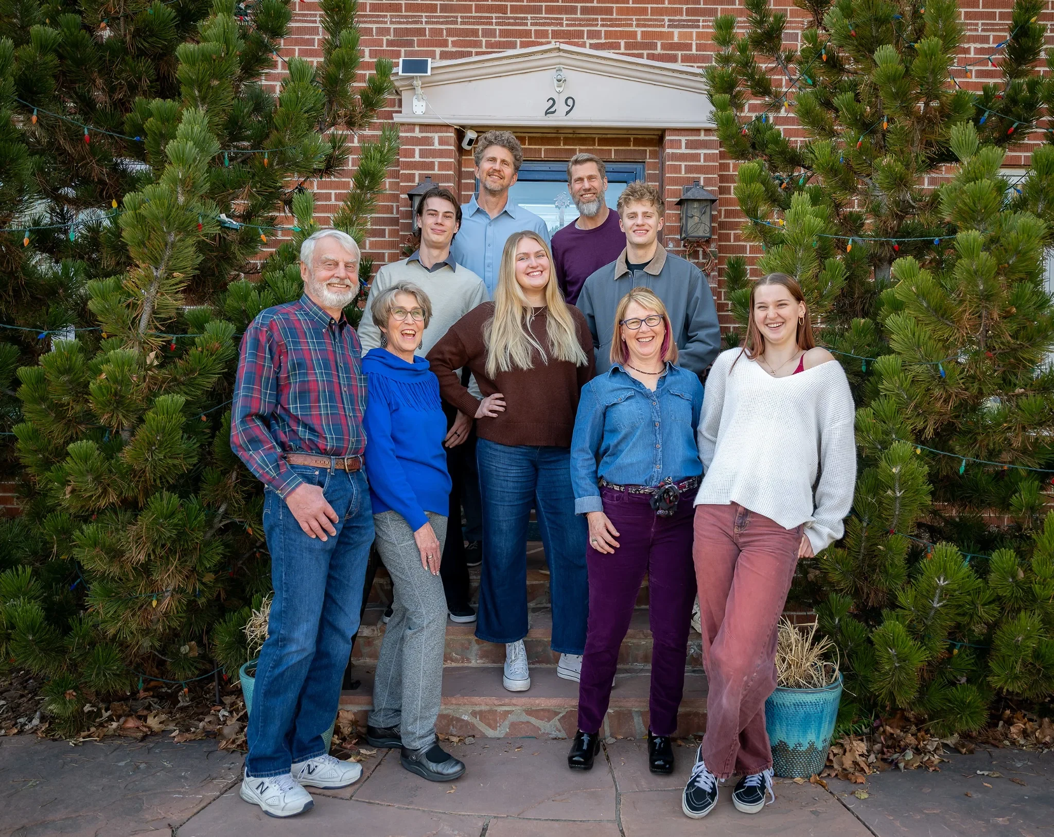 Family portrait at front door of home in Denver, Colorado captured by Ryan Kost Photography