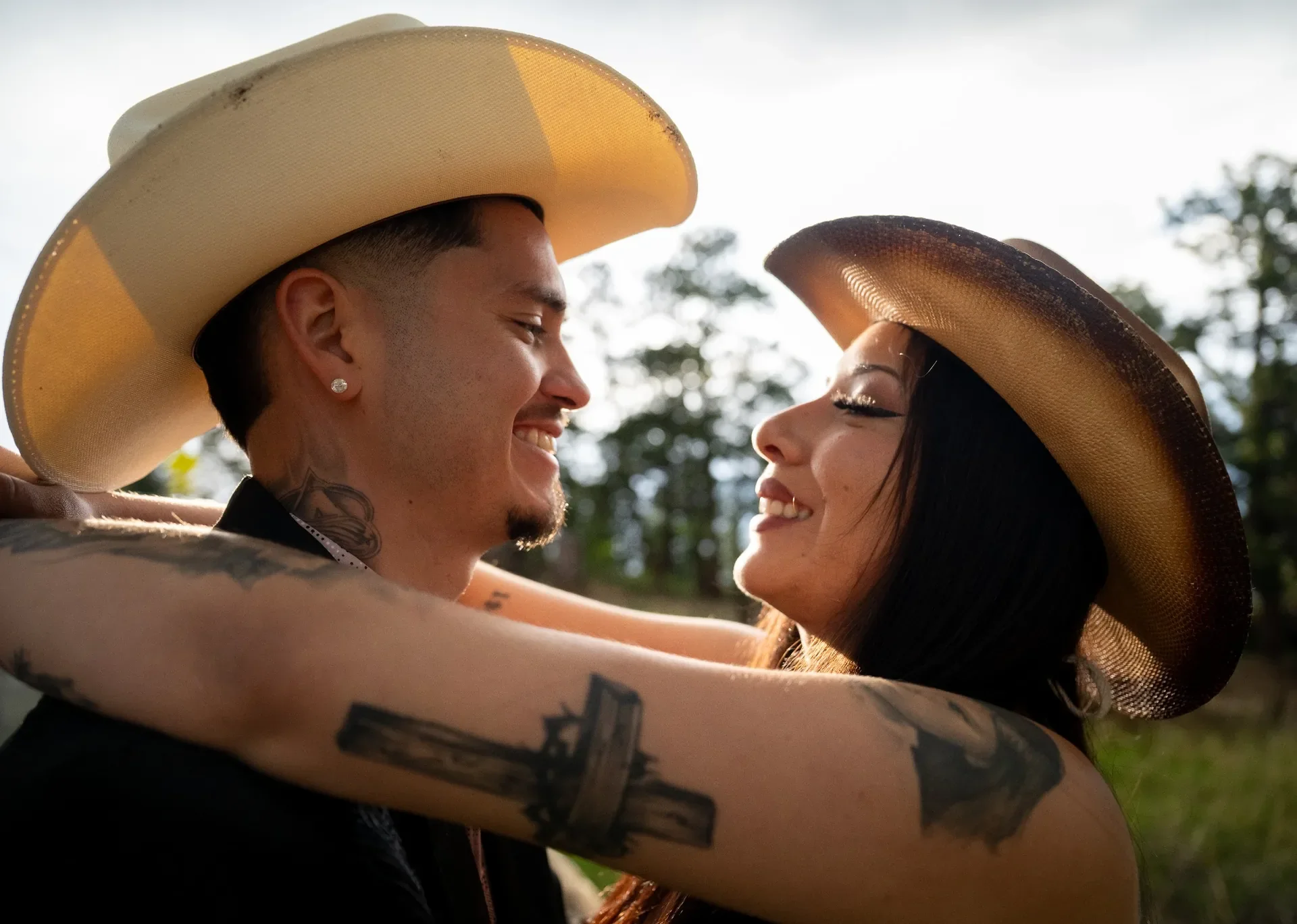 Couple giving loving looks during a surprise engagement proposal photo session on Lookout Mountain in Golden, Colorado.