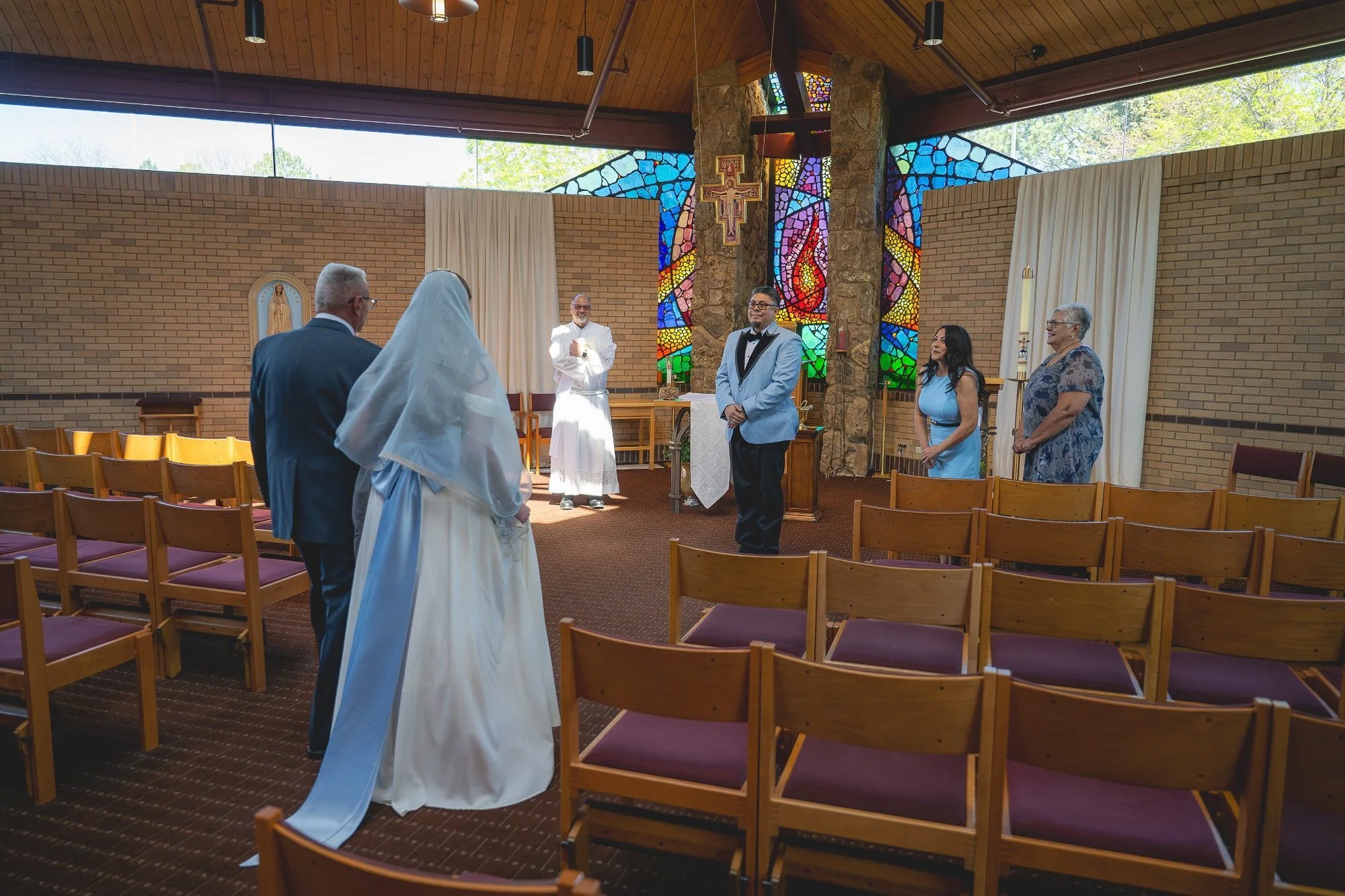 A stunning fusion of natural light and dramatic color, this church elopement in Arvada, CO is both intimate and visually striking, captured by Ryan Kost.