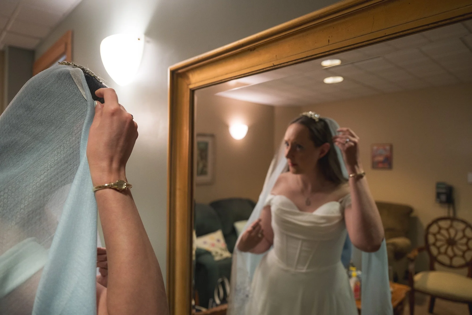 Bride getting ready in powder room.  A deeply heartfelt and dramatic elopement at Spirit of Christ Church in Colorado, styled with natural light and an intimate, soulful lens by Ryan Kost.