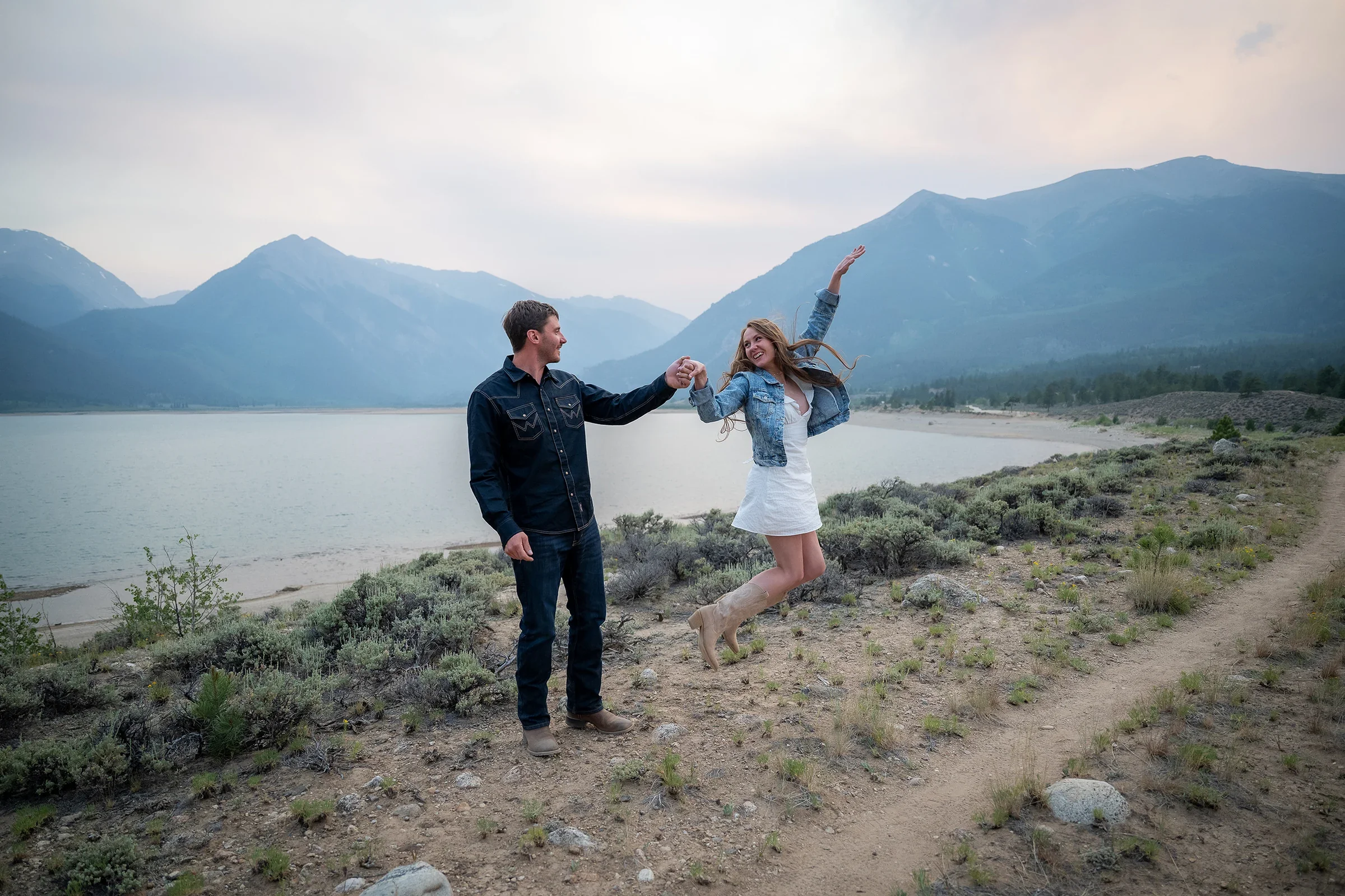 Jumping for joy portrait of newlyweds celebrating their summer elopement in the Colorado Rockies.