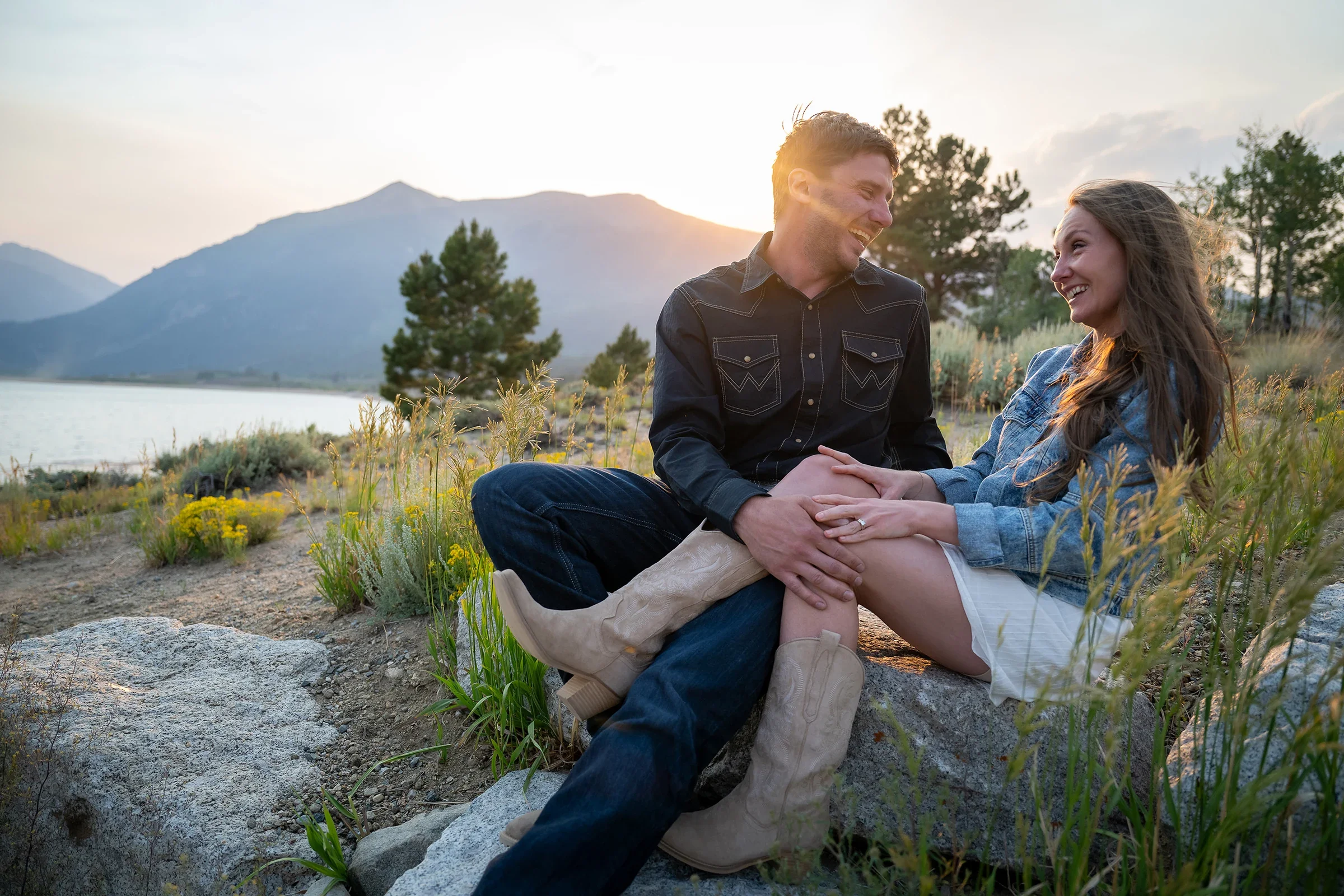 Candid portrait of newlywed couple laughing together during their Colorado mountain elopement at Twin Lakes.