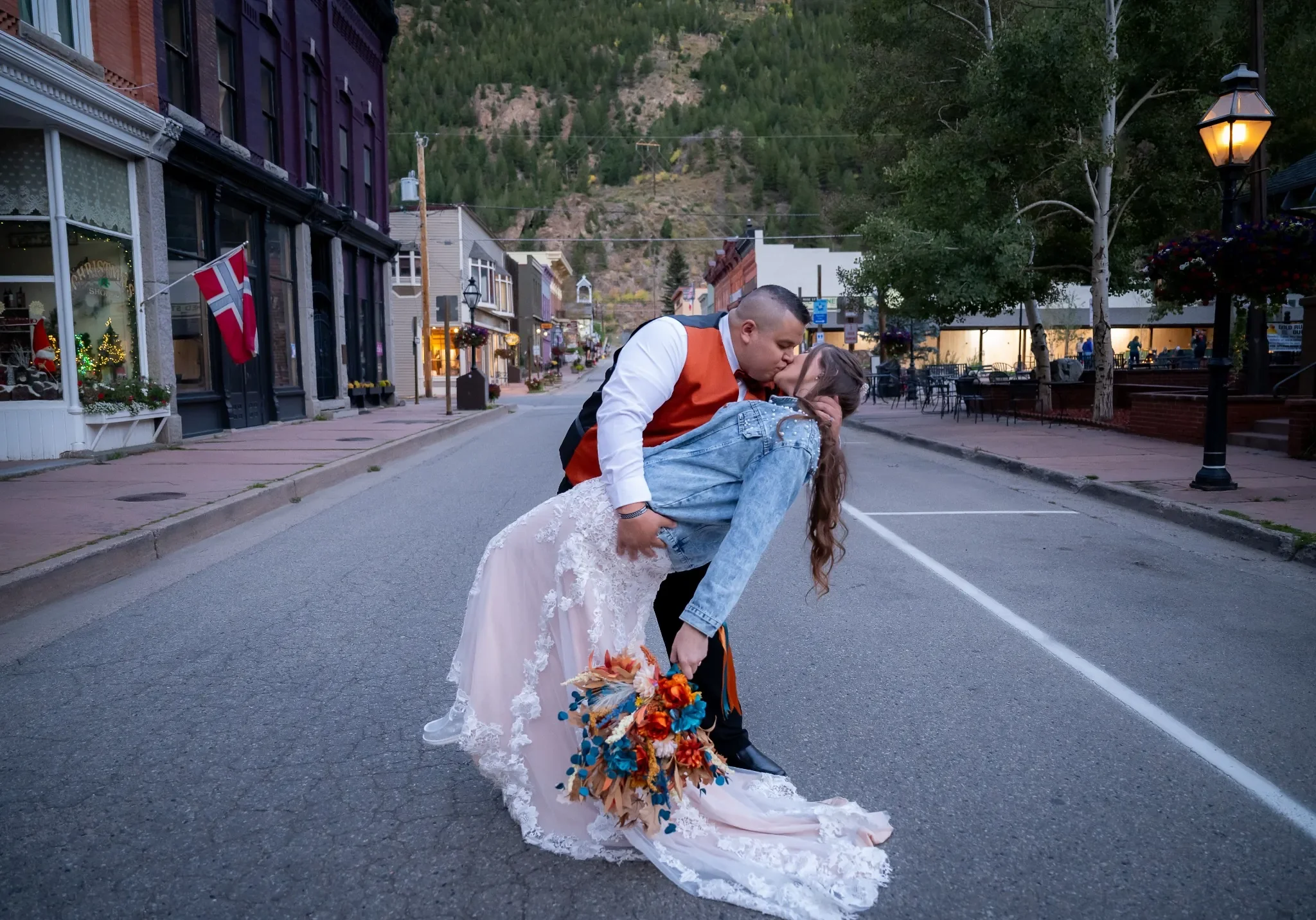 Bride and Groom sharing a beautiful kiss in the middle of downtown Georgetown, Colorado. Intimate and beautiful wedding photoraphy by Ryan Kost