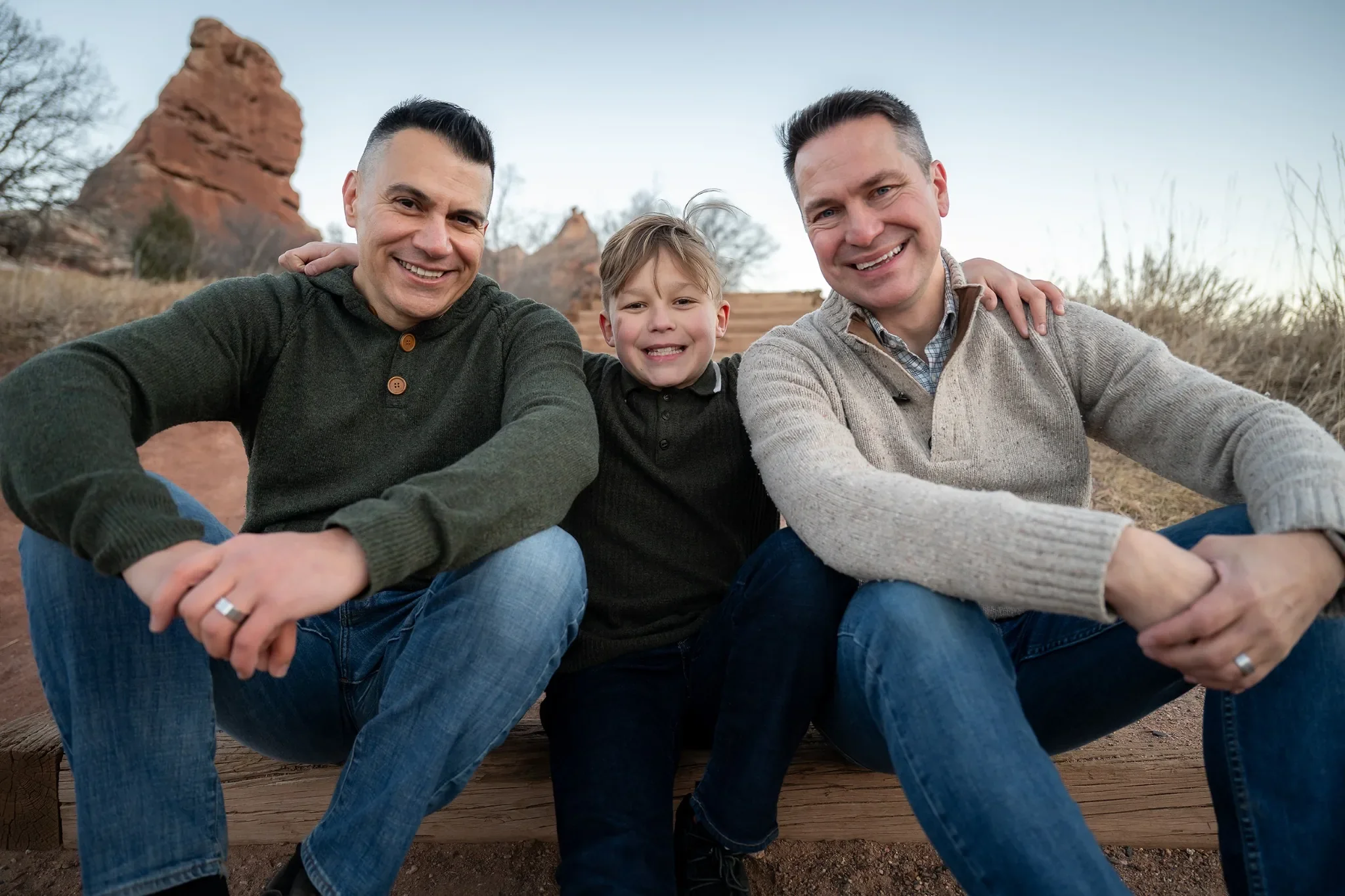 Natural family portrait sitting on stairs. Outdoor family photography session at South Valley Park Littleton Colorado.
