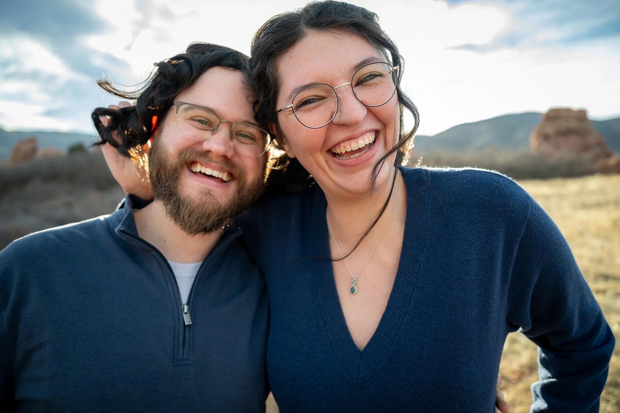 Candid engagement session of a couple laughing together at South Valley Park in Littleton, Colorado photographed by Ryan Kost