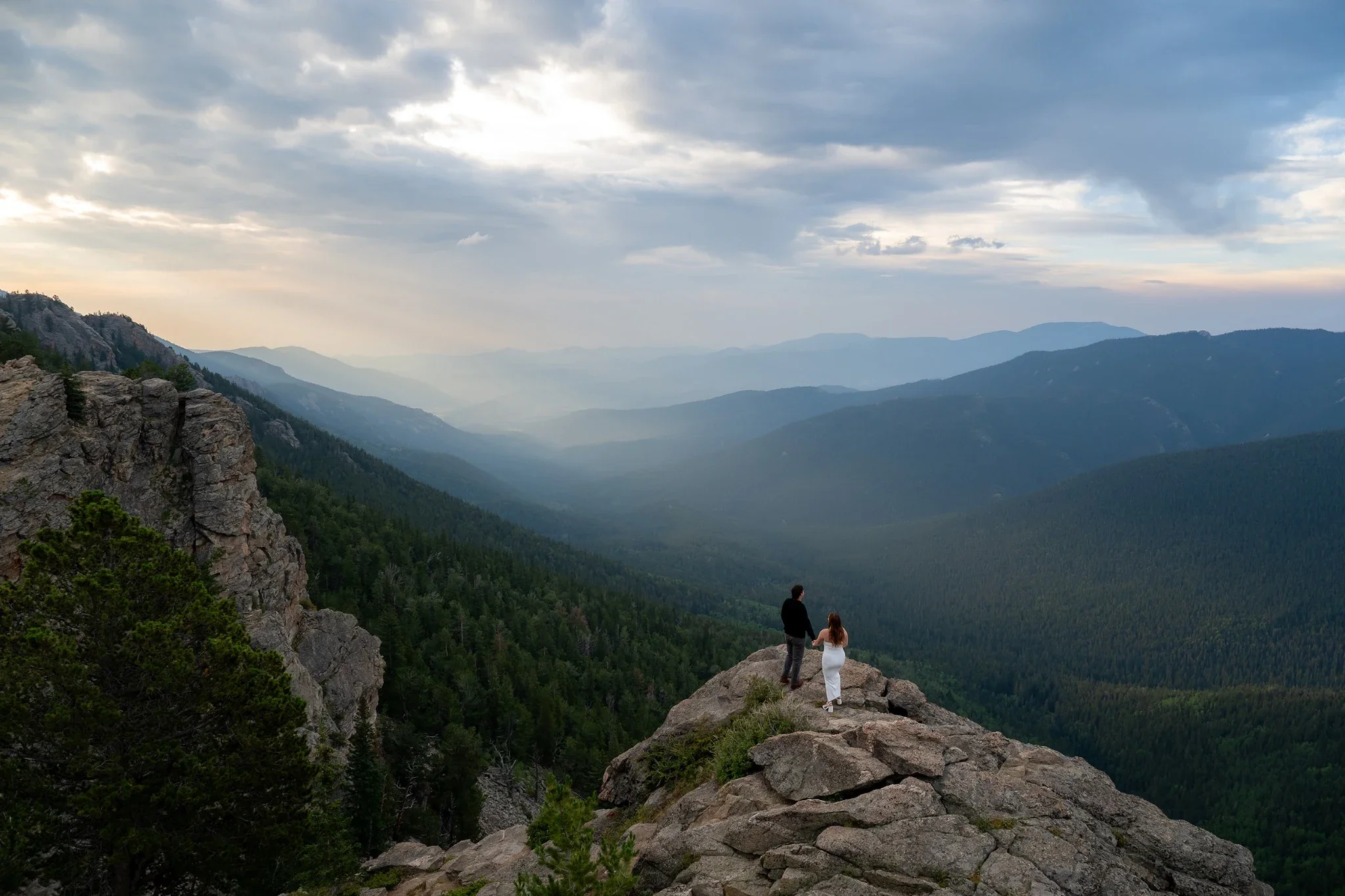 A dramatic and dreamy morning mountain sunrise engagement photoshoot  at Junper Pass in the Colorado Rocky Mountains captured by Denver photographer Ryan Kost