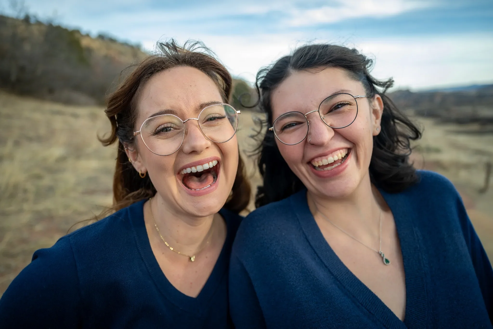 Pure joy laughing together during a fun winter family photo session in South Valley Park, Colorado. Ryan Kost Photography