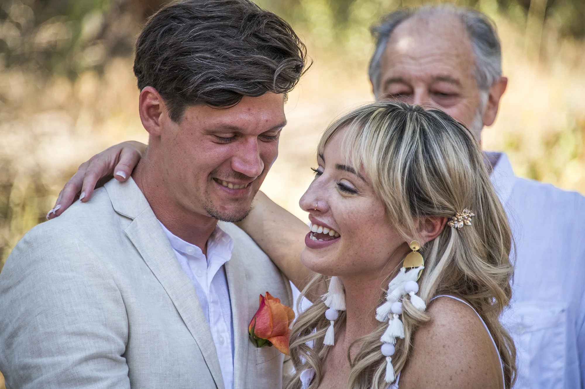 Bride and Groom embrace after getting married in an intimate backyard wedding ceremony on Lookout Mountain in Golden, Colorado. Ryan Kost Photography