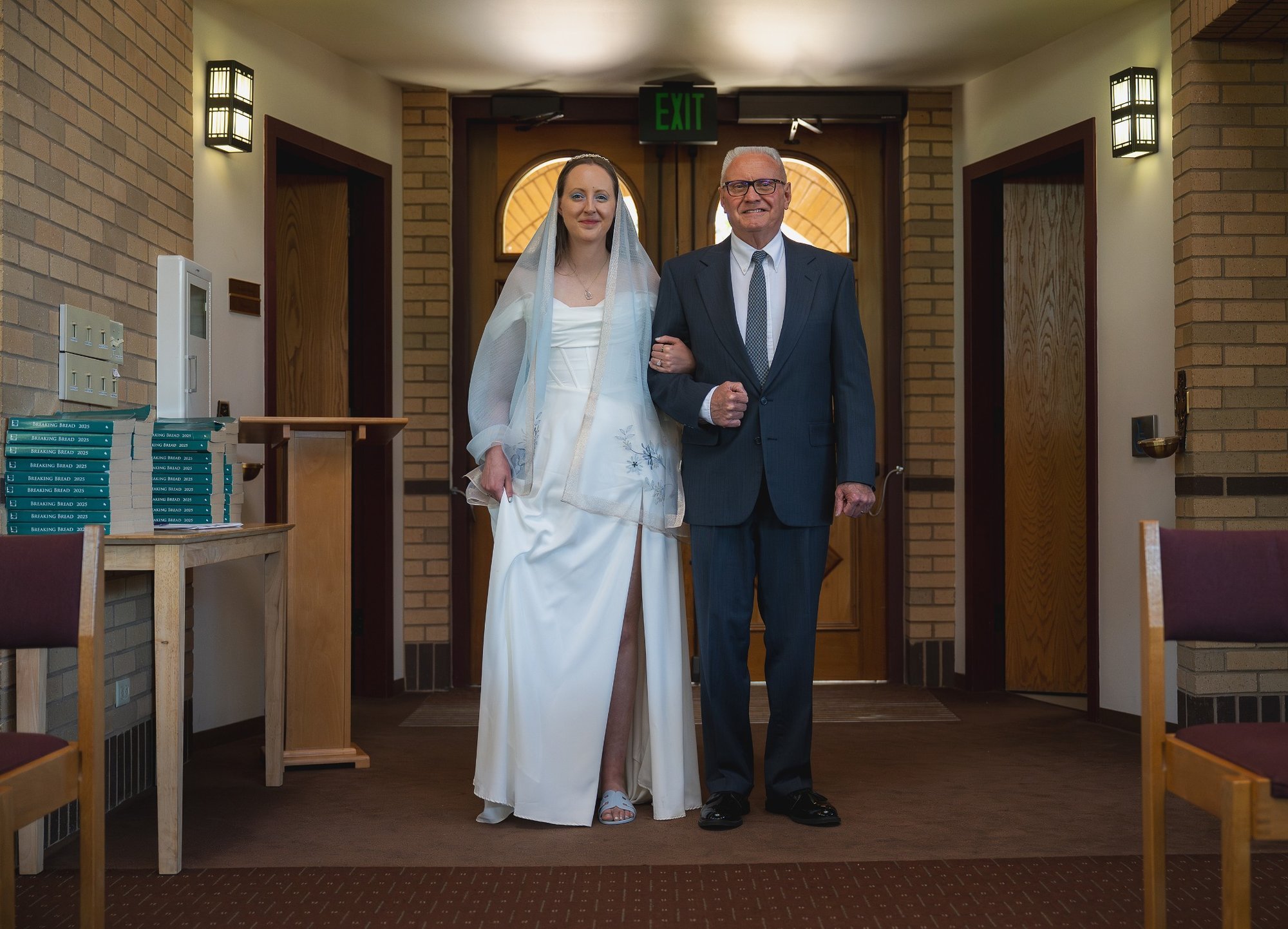 Bride and Dad. Timeless elopement moments in Arvada, Colorado—moody chapel light and cinematic emotion captured by Colorado elopement photographer Ryan Kost.