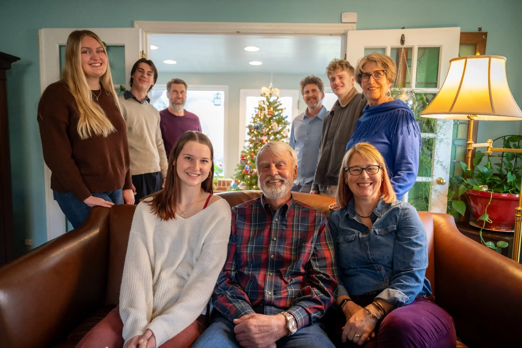 Family Portrait in living room during the holidays in Denver, Colorado captured by Ryan Kost