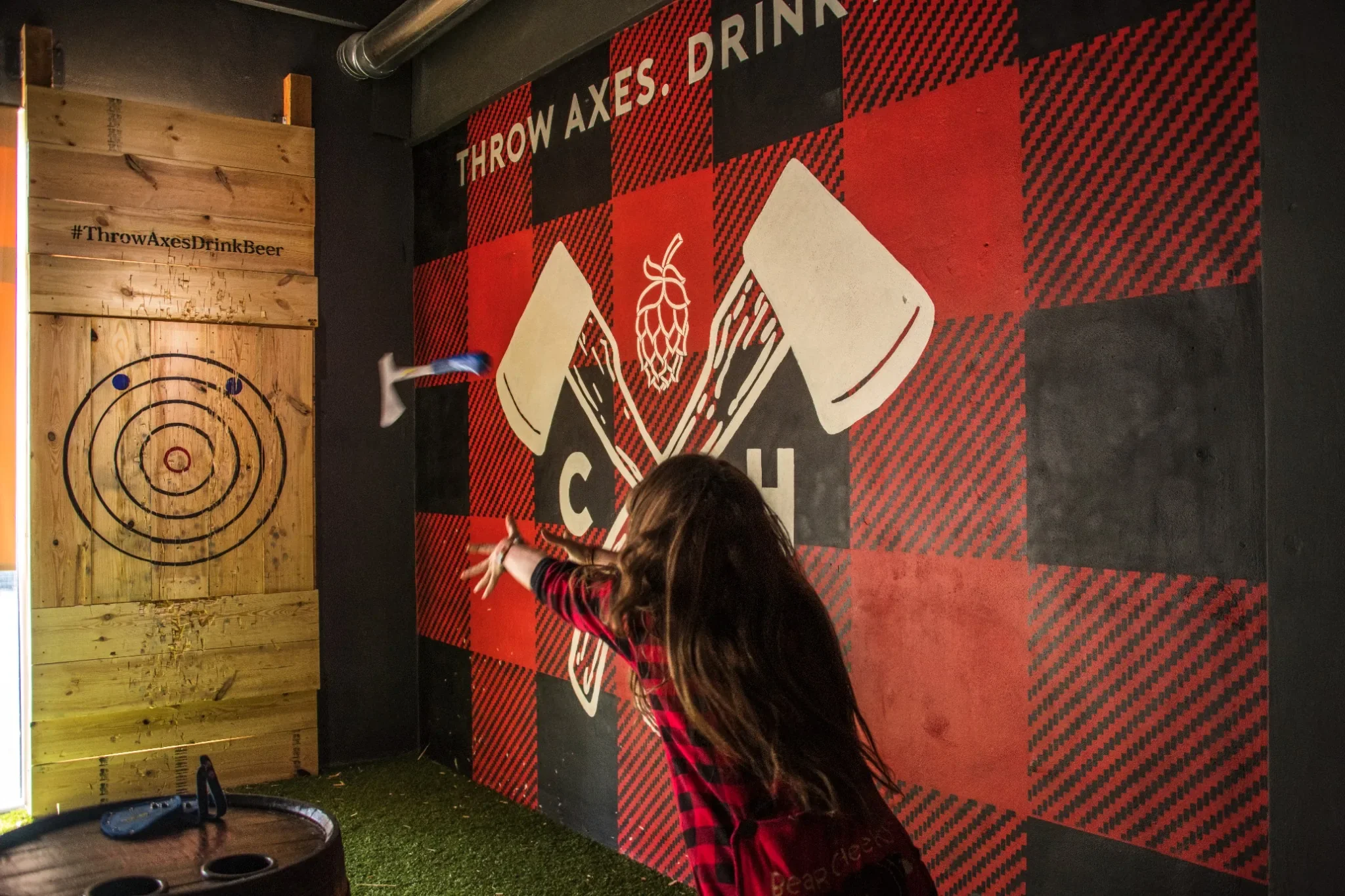 Axe throwing at a Fort Lauderdale bar, captured for marketing and branding photography showcasing energetic nightlife, local business culture, and authentic experiences.