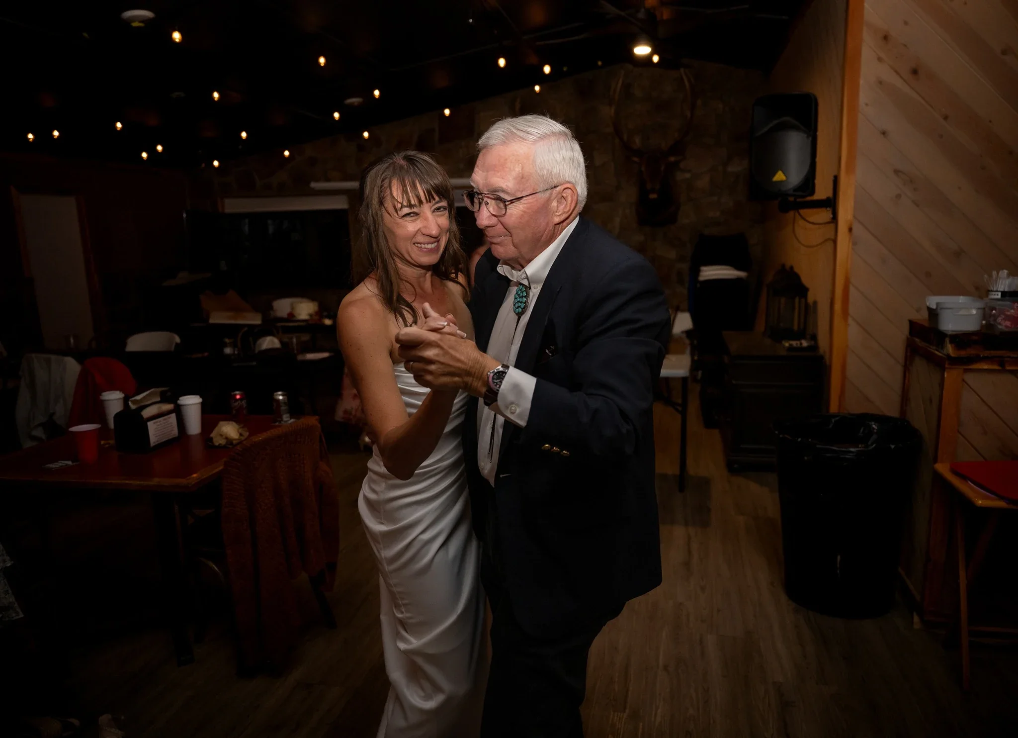 Bride and her dad share a dance during wedding reception at Red Bear Haus in Horca, Colorado.