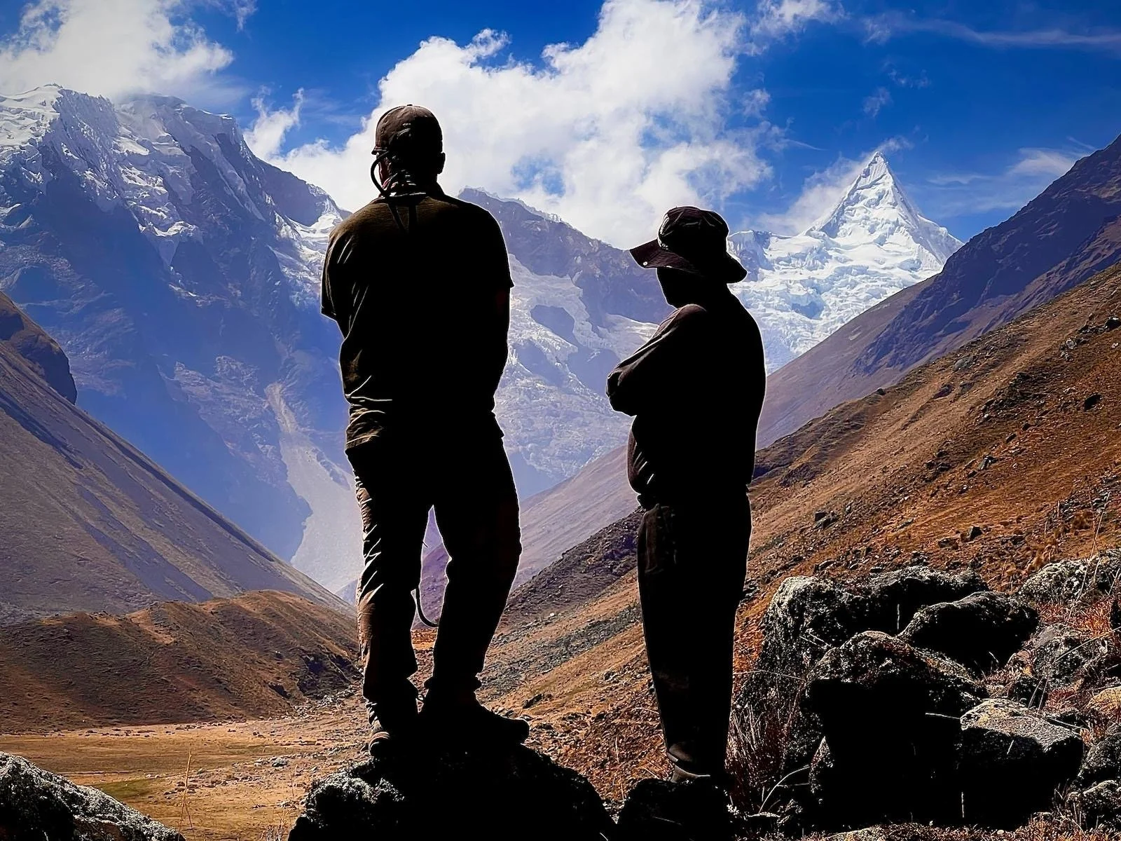 Ryan Kost, Colorado photographer and Lucio take in the beauty of Alpamayo in the Cordillera Blanca, Peru