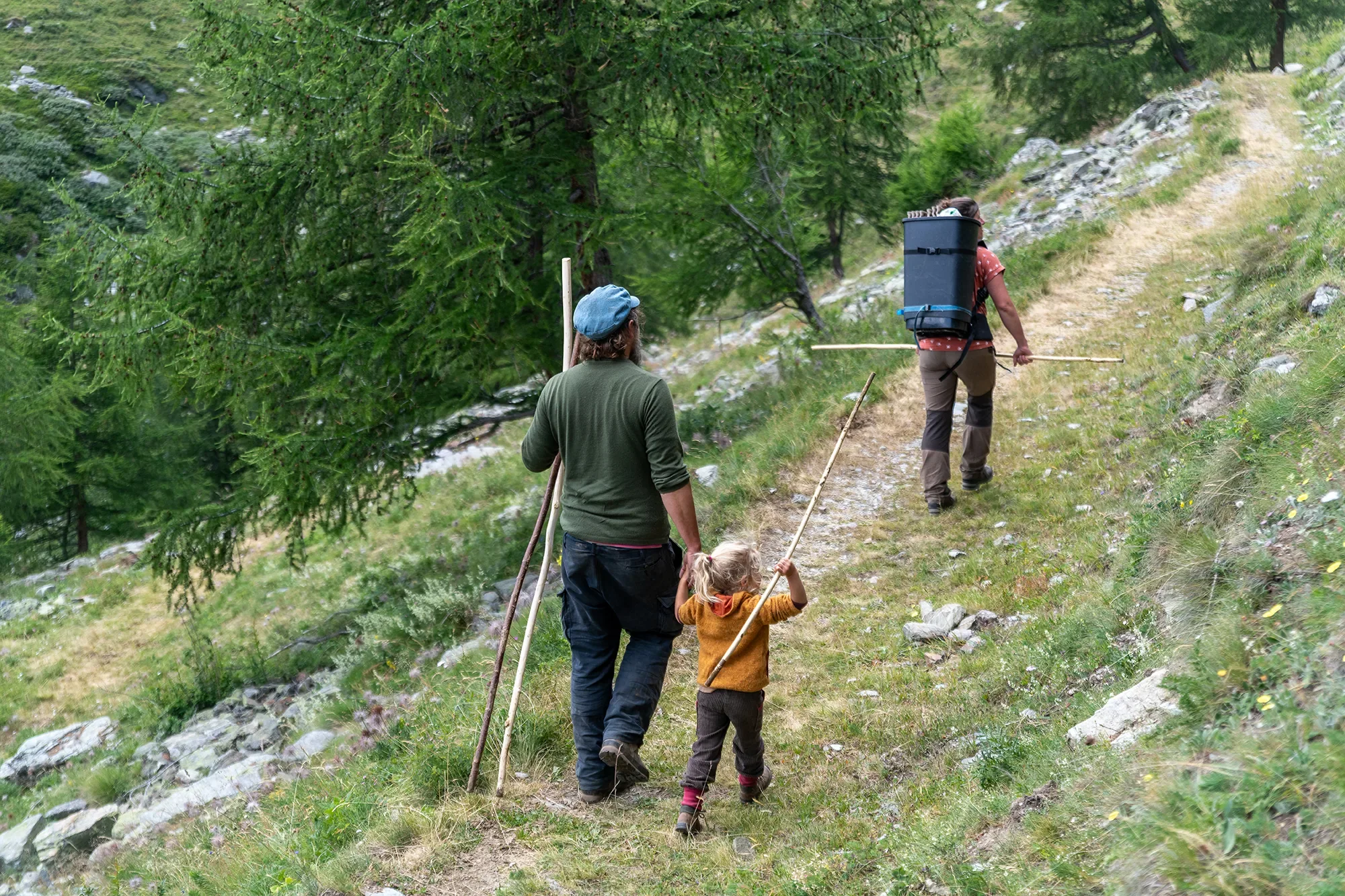 A family outing up to their alpine orchard in late summer to pick fruits in St. Nicklaus, Switzerland. Ryan Kost Photography