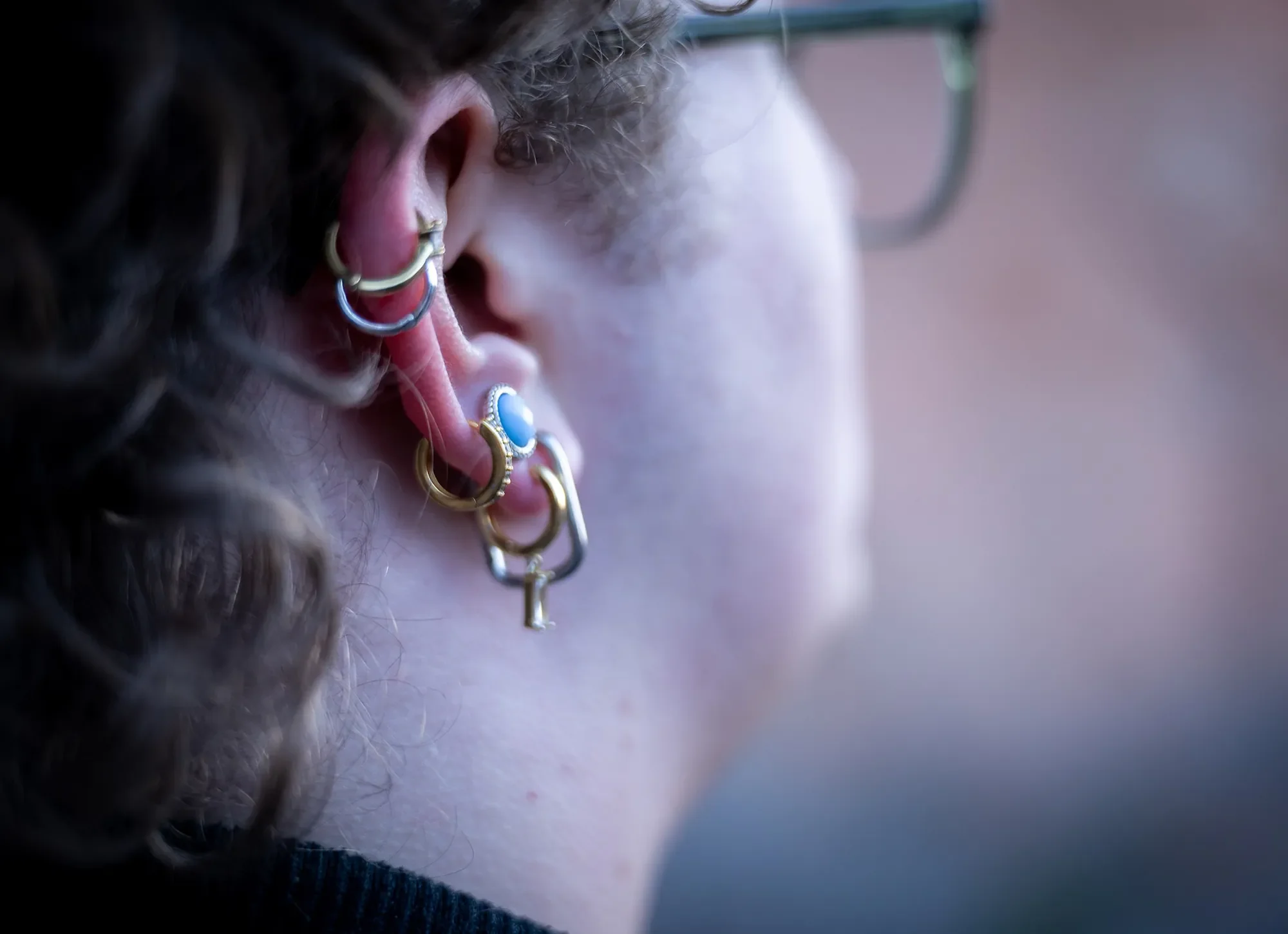 Ear piercings. Cool high school senior portraits captured at Garden of the Gods in Colorado Springs by Ryan Kost Photography.