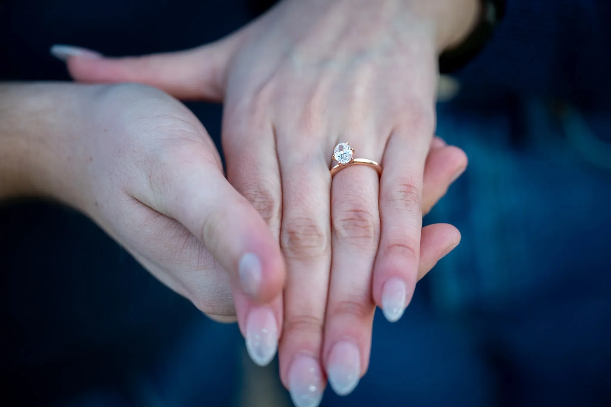 Closeup of engagement ring during a surprise proposal photo session at South Valley Park in Littleton, Colorado