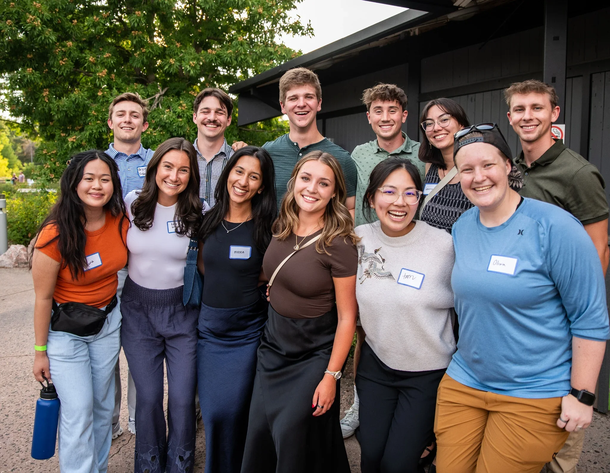 Relaxed group portrait of employees at a Summer party. Denver, Colorado corporate event photography captured by Ryan Kost