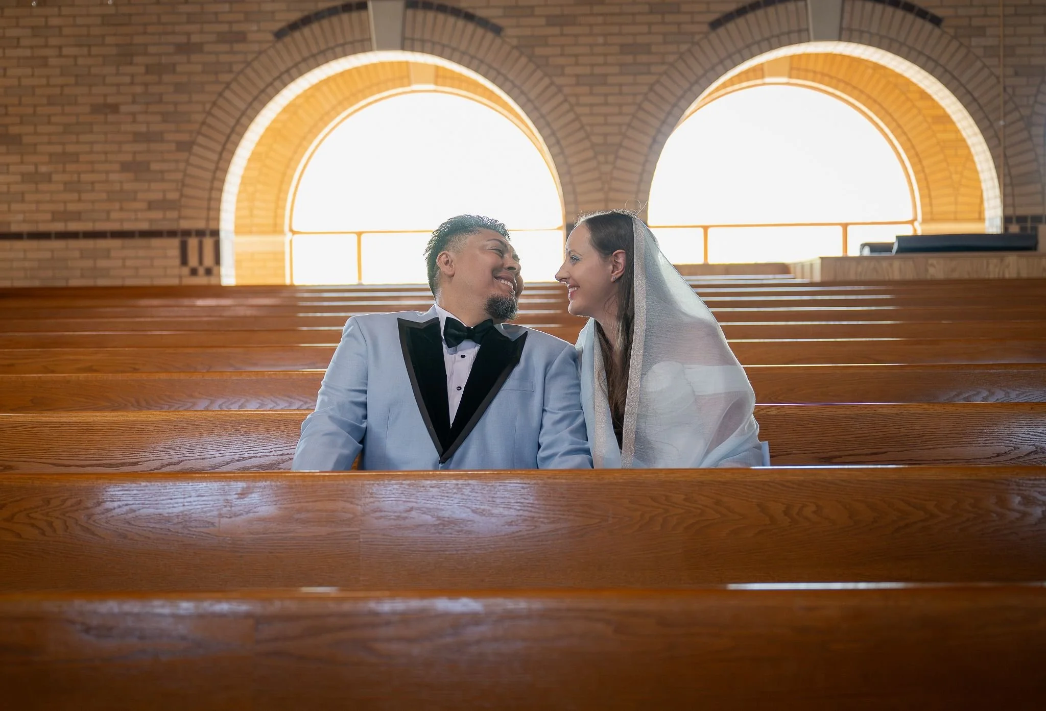 Artful storytelling through the lens—intimate elopement portraits from Spirit of Christ Church in Arvada with a beautiful balance of drama and love by Ryan Kost.