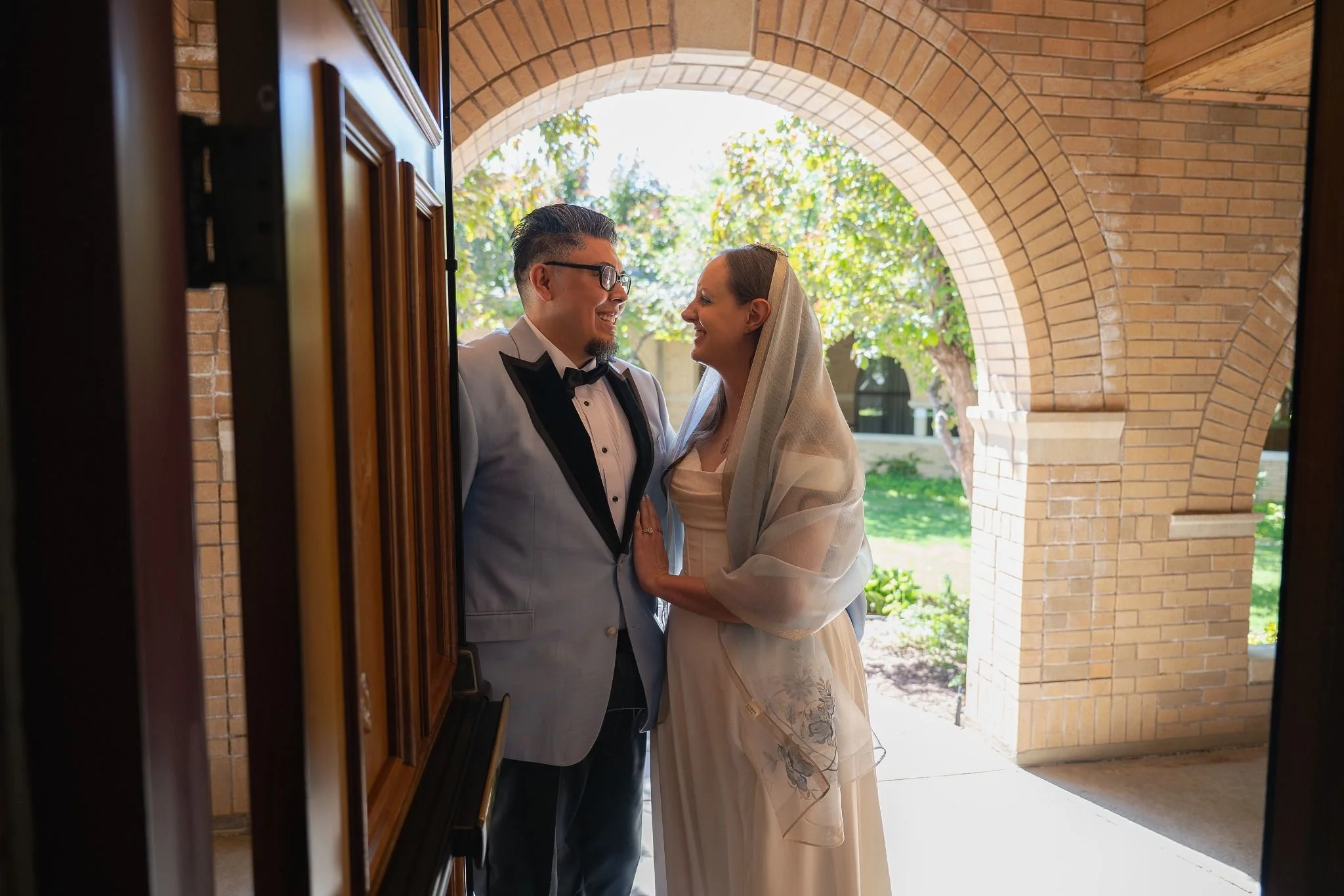 Moody and magical elopement photography in a sacred church setting—raw emotion and timeless love artfully preserved by Ryan Kost.