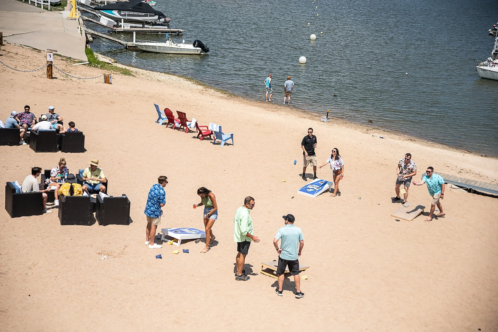Employees enjoying fun and games during a summer corporate event at Cherry Creek Reservoir in Denver, Colorado. Ryan Kost Photography