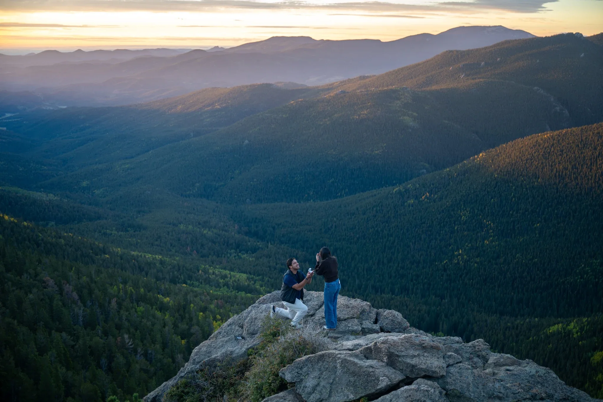 Taking a knee during a sunrise fall proposal at Juniper Pass in Colorado. Ryan Kost Photography
