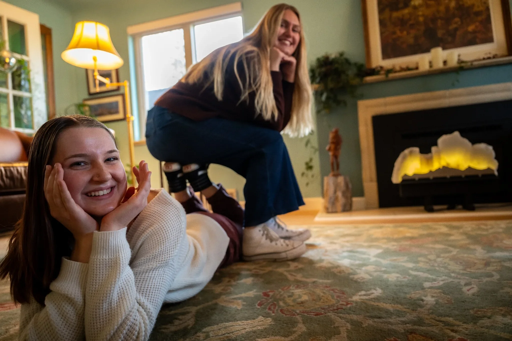 Fun cousins portrait in living room at home in Denver, Colorado captured by family photographer Ryan Kost.