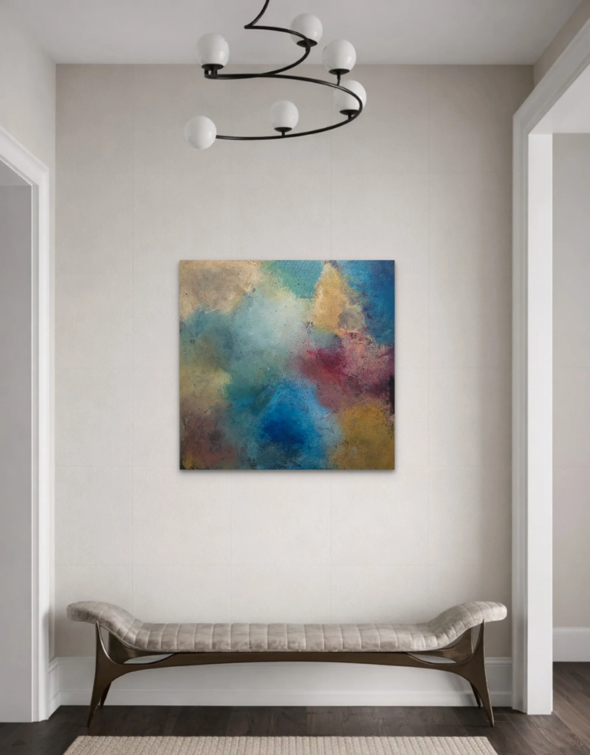Modern foyer with a built-in bench, abstract colorful artwork on the wall, and a black chandelier with white globes.