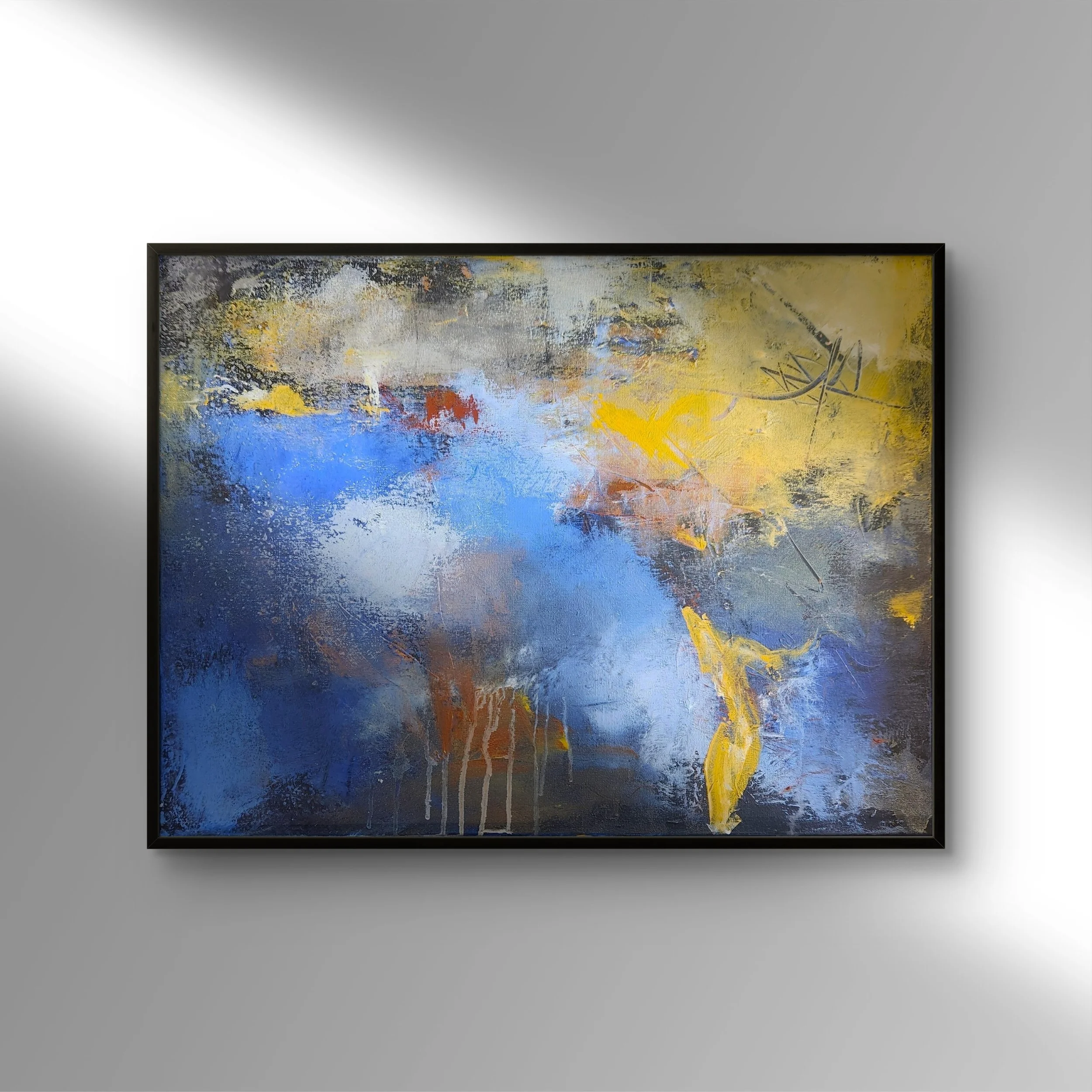 Abstract painting hanging on dark gray wall above brown leather couch with multi-colored cushions in a living room.