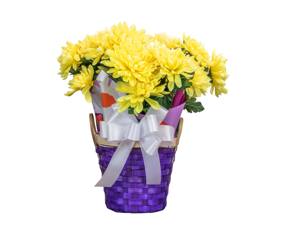 Yellow chrysanthemums in a purple woven basket with a white ribbon, wrapped in decorative paper.