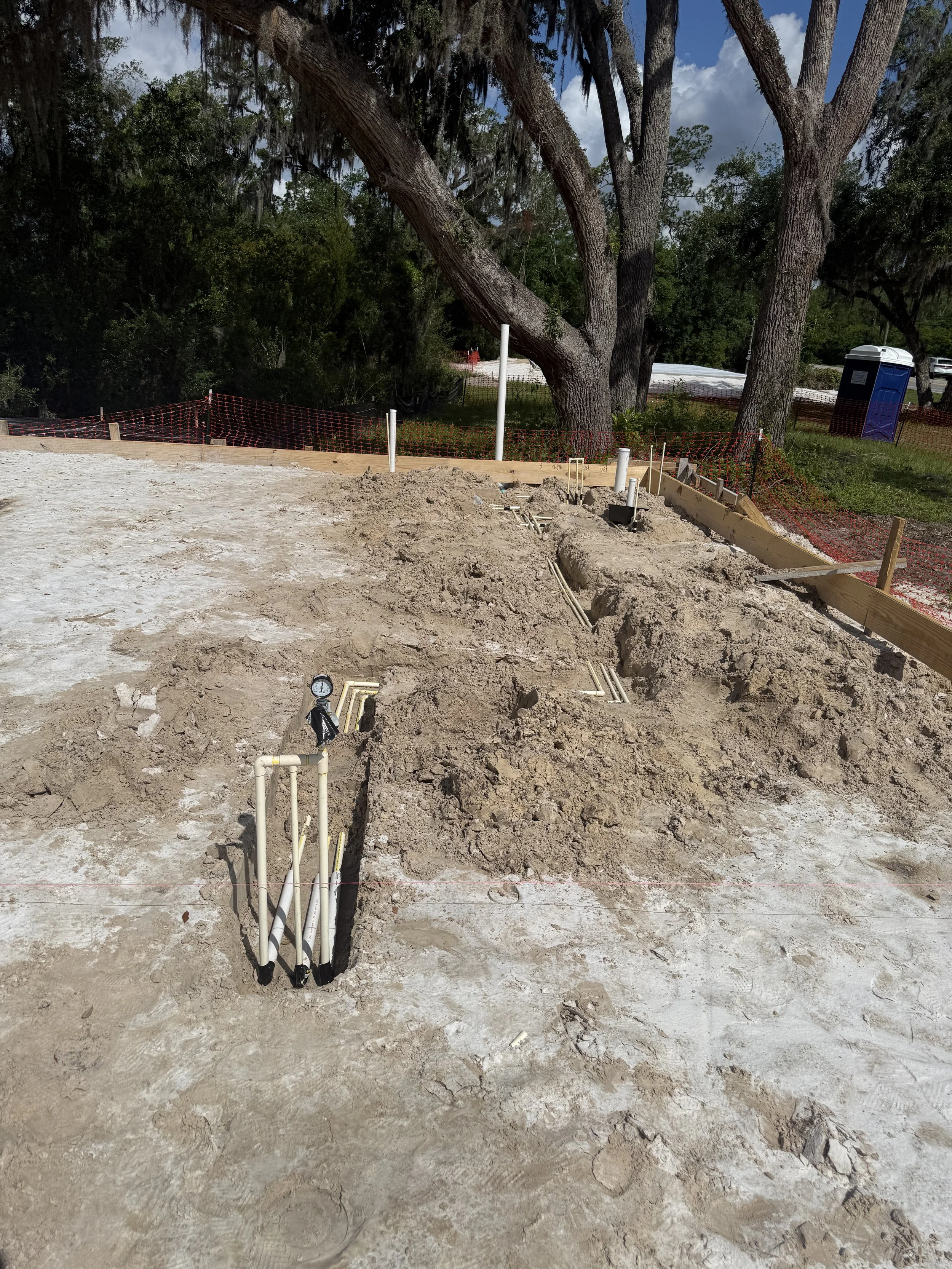 Underground plumbing and utility rough-ins begin for this new custom home off State Road 16 near SilverLeaf in St. Augustine, Florida. Elite Construction of JAX builds custom homes throughout St. Augustine, Jacksonville, St. Johns County, and Northea