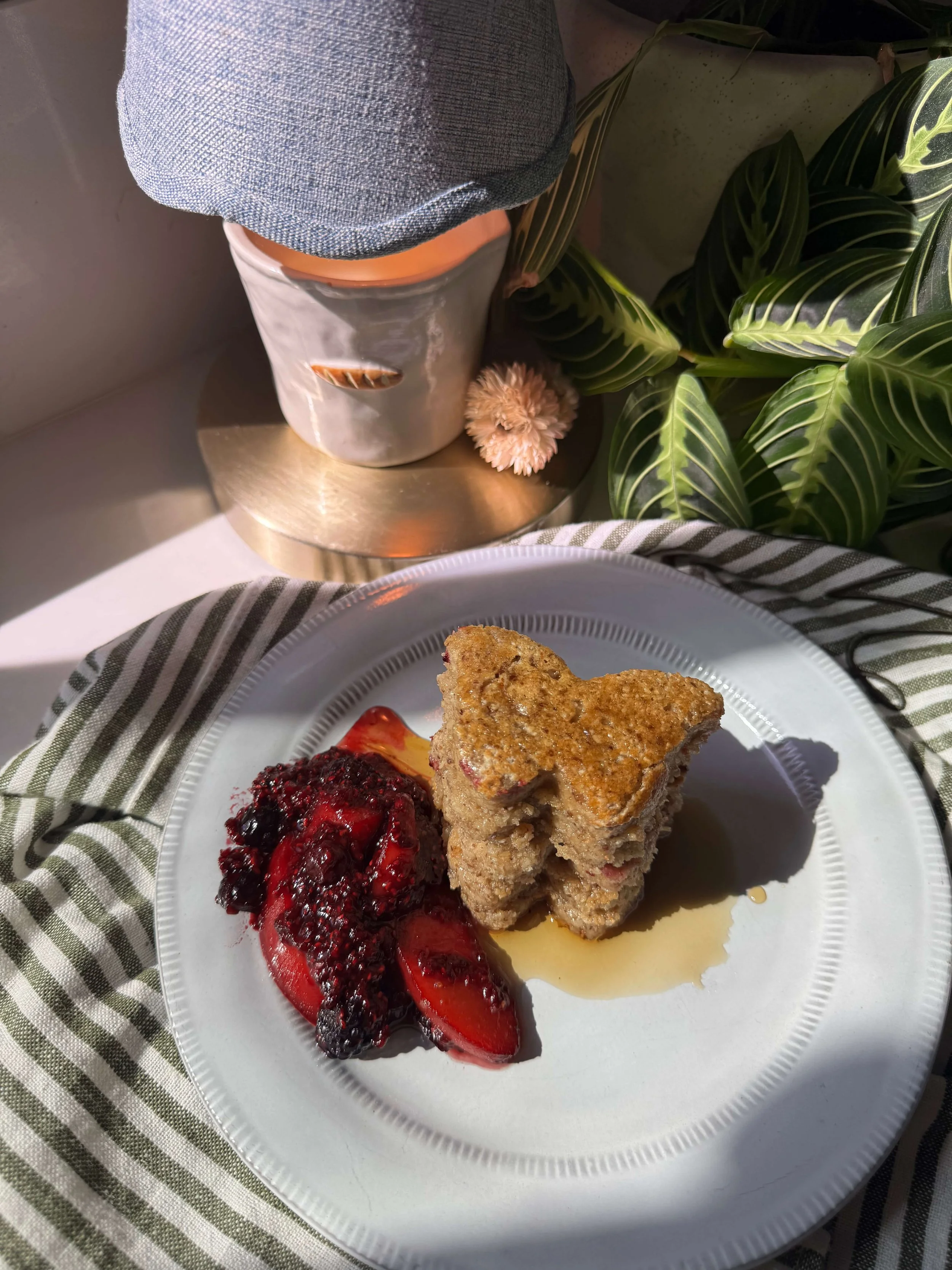 These Nourishing Protein Labor Pancakes are soft blender pancakes made with oat flour, yogurt, flax, maple syrup, and raspberry chia jam for labor prep and postpartum nourishment plate berries candle