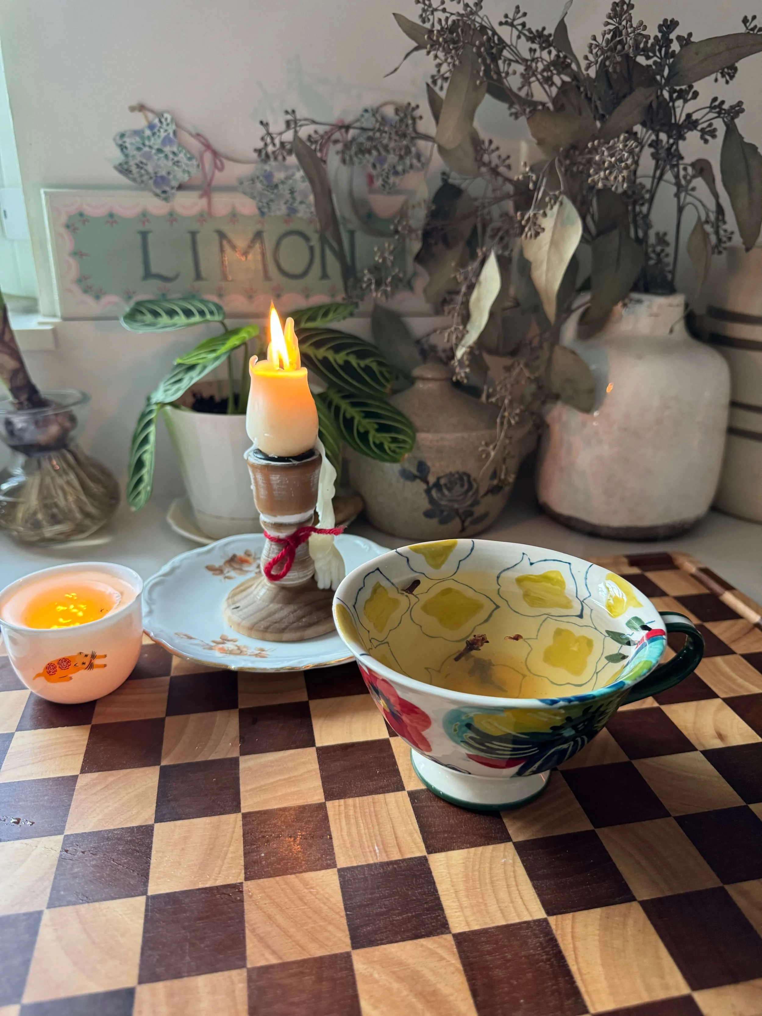 clove tea with candle on counter kitchen