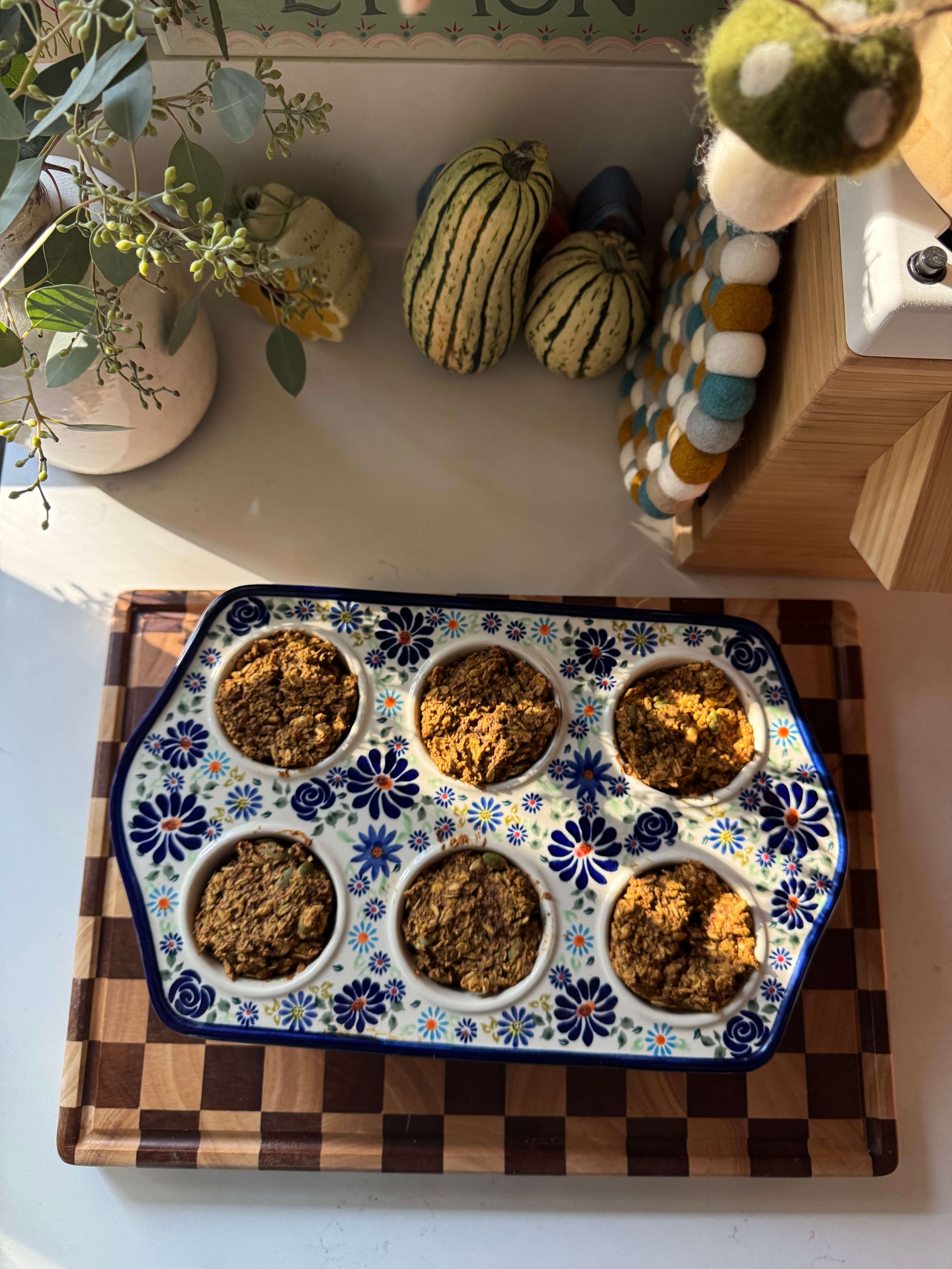 oven mit gingham holding muffins in ceramic muffin pan kitchen blue mushroom garland pumpkin muffins