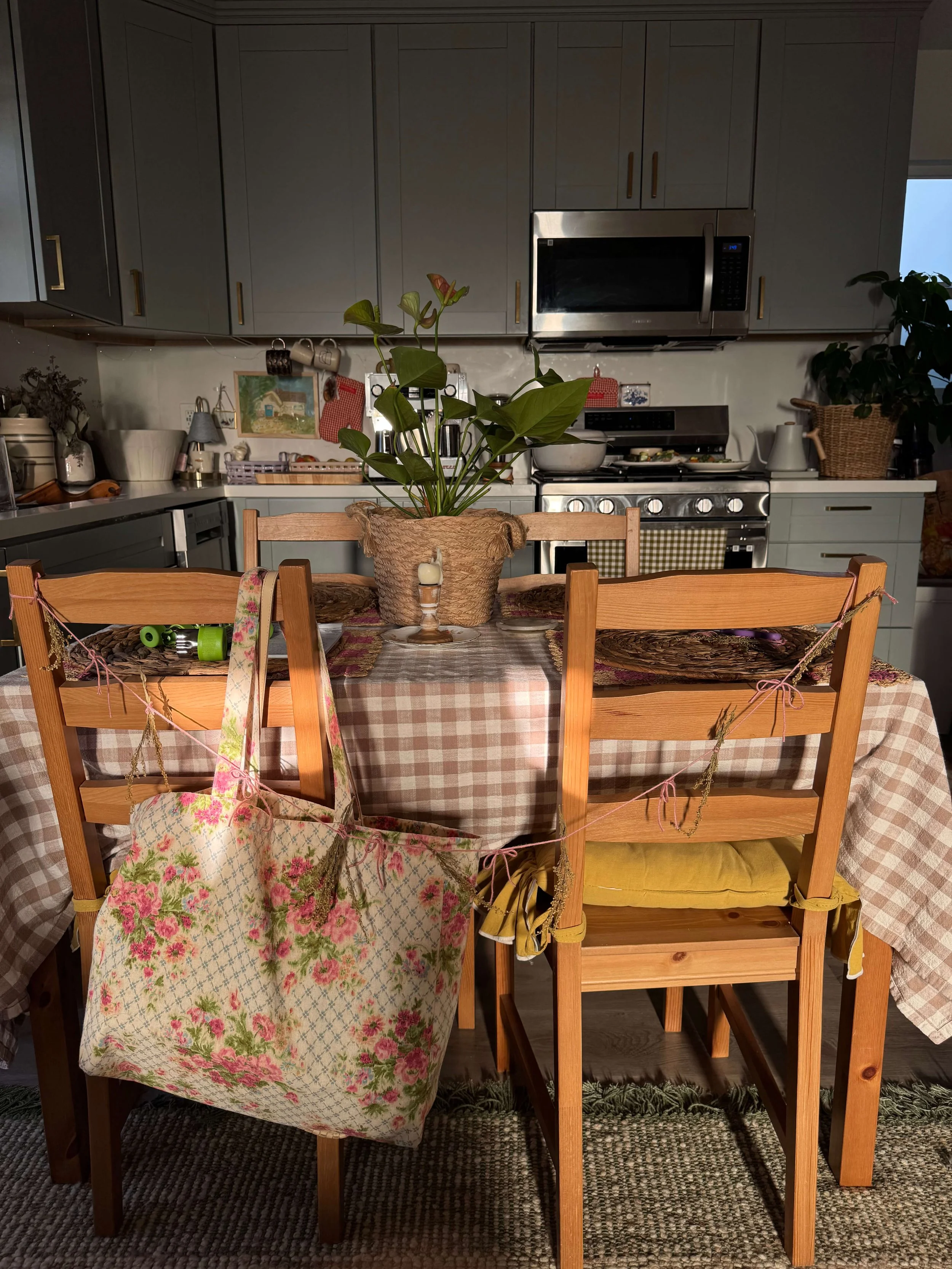 kitchen table with garland attached to chairs pink garland gender reveal yellow seat covers