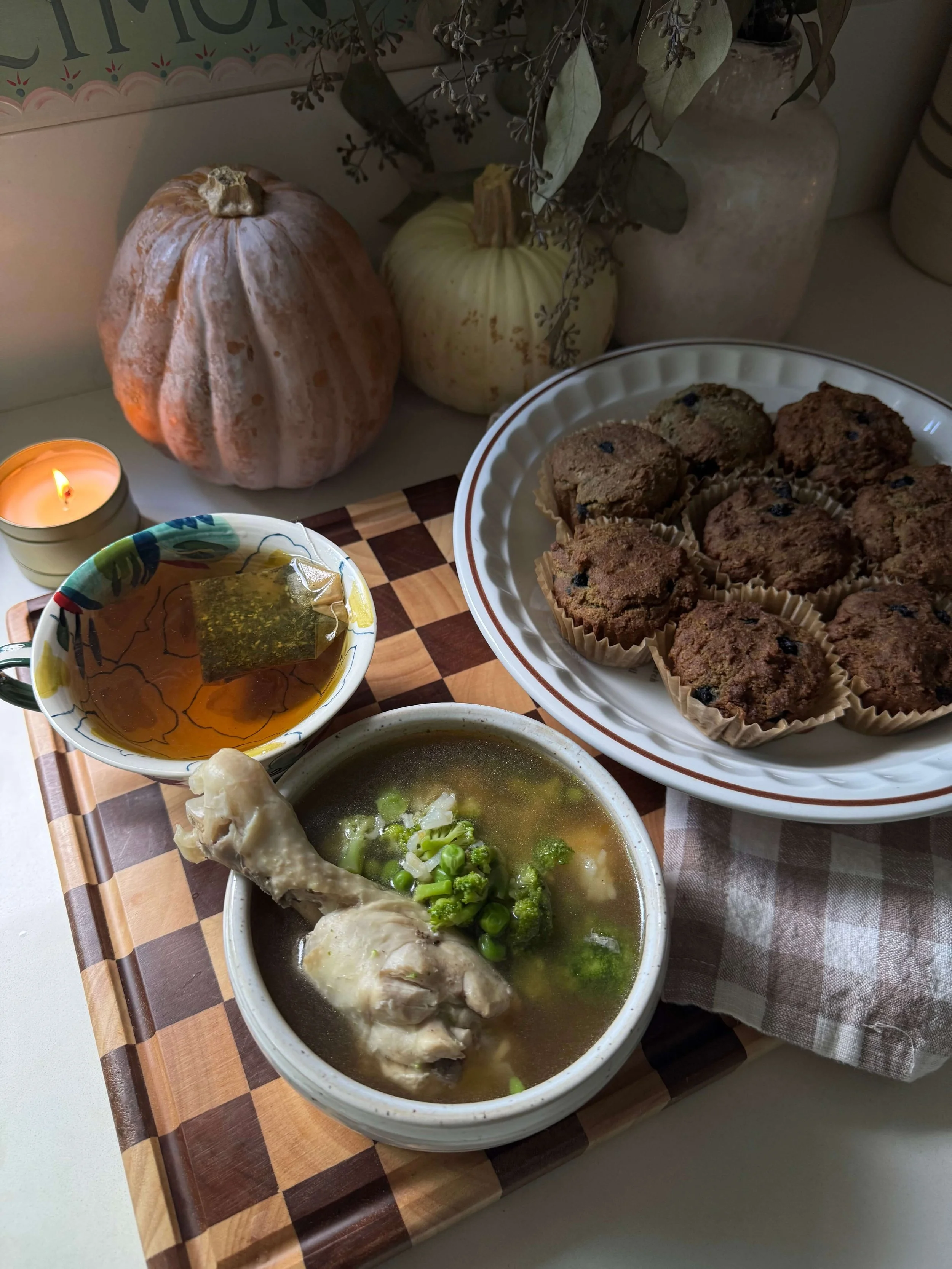 wenatal supplements infant of muffins in muffin pan by candle light in kitchen