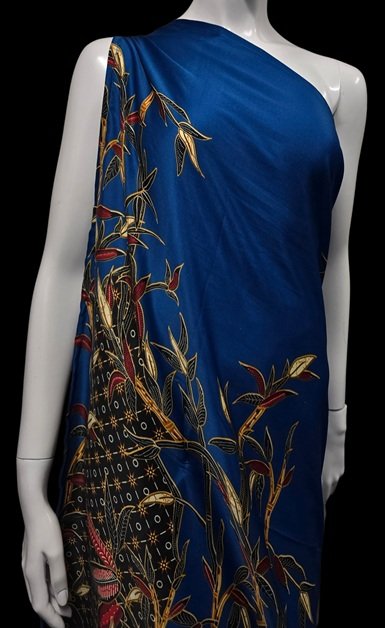 Blue DONBERNAE wrap dress with gold botanical island-inspired patterns
