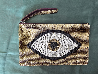 Gold eye purse.png