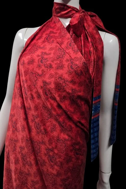 Red tropical fabric styling with elegant wrap and island-inspired design
