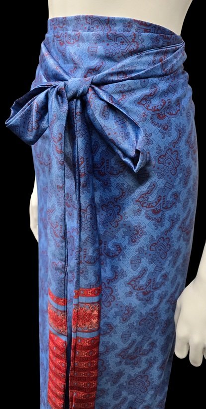 Blue tropical fabric with red artisan detailing inspired by island luxury