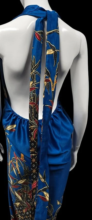 Blue floral silk scarf styling paired with relaxed luxury resort fashion