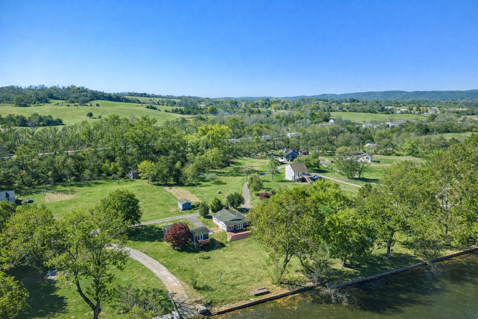 Houses arial river distant.png
