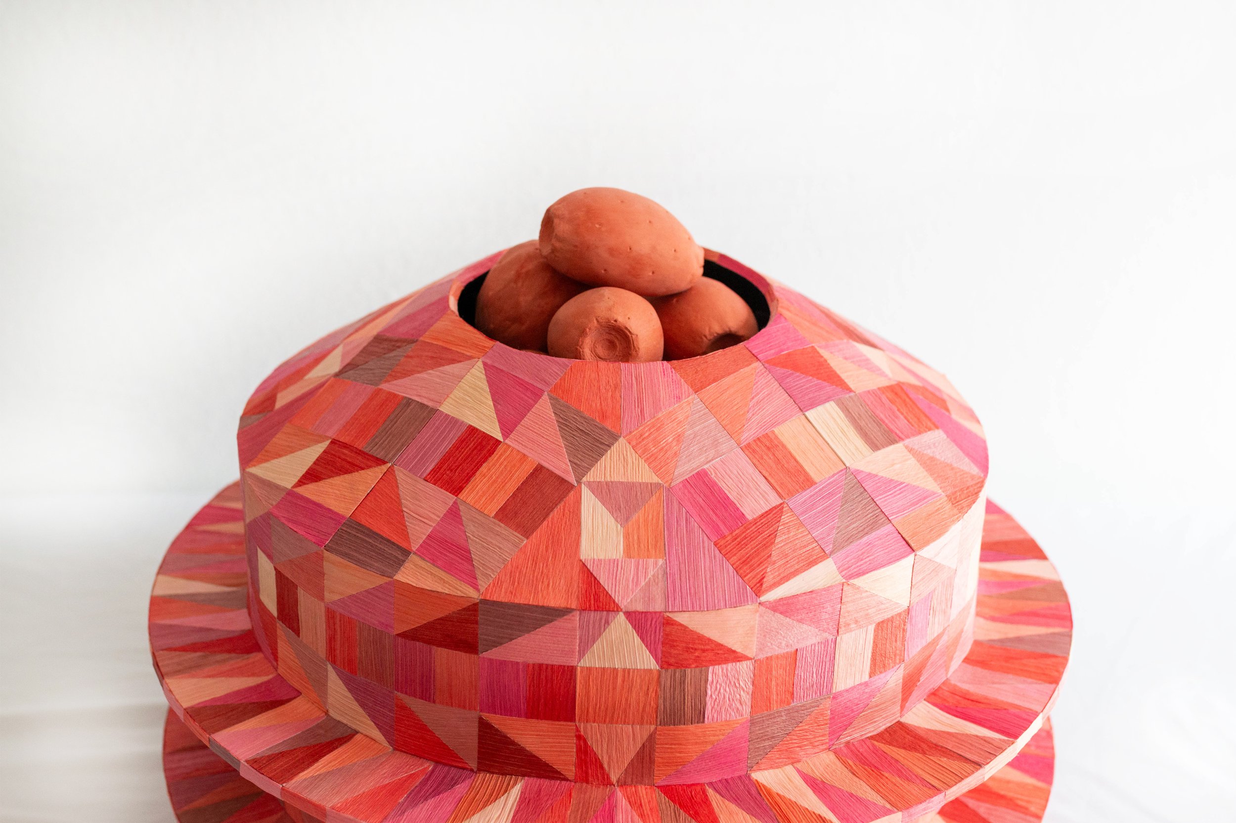 Regalos/Worth Keeping -
Corn husk, cardboard, paper mache, plaster, acrylic paint. Photo by Alex Nieto
