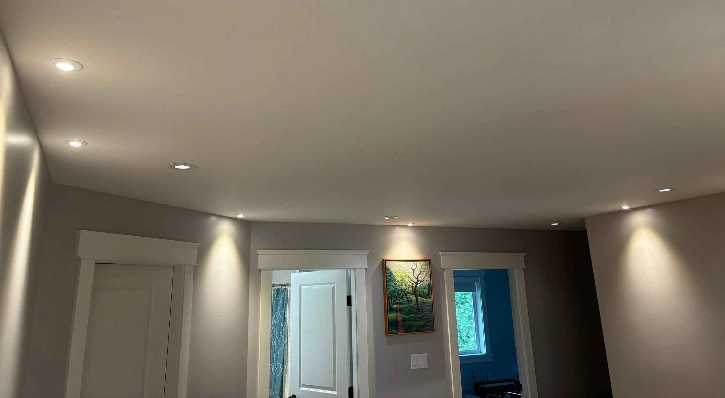 Recessed LED pot lights installed across a living room ceiling in a Victoria home