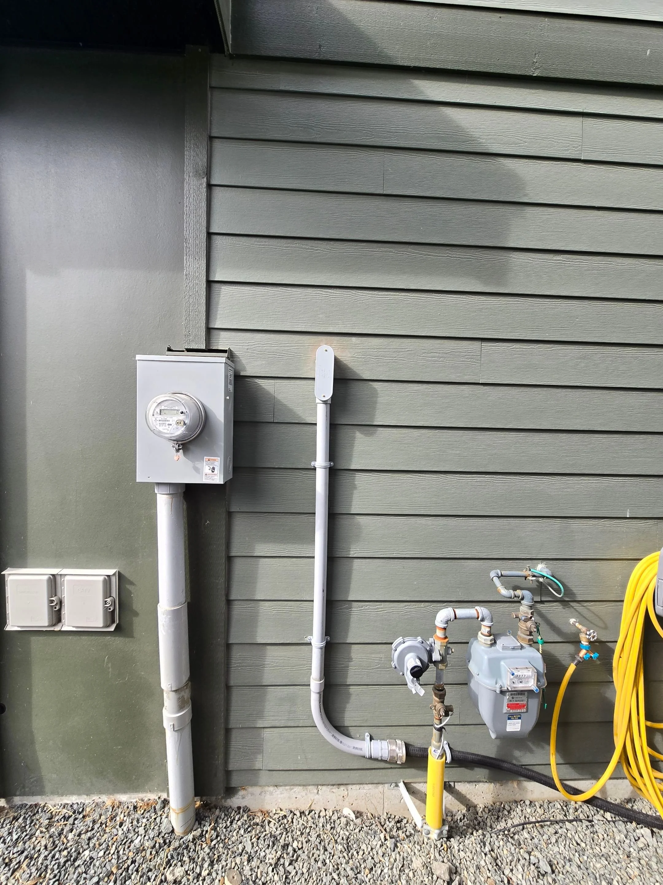 Tidy exterior electrical run from the meter base along the home for a new hot tub circuit