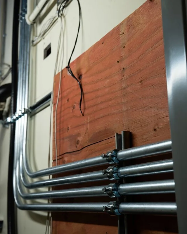 Parallel runs of EMT conduit installed to feed a relocated electrical panel