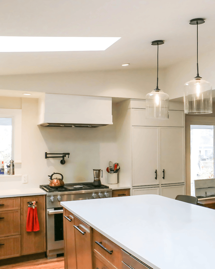 Under-cabinet lighting and pot lights wired during a kitchen remodel