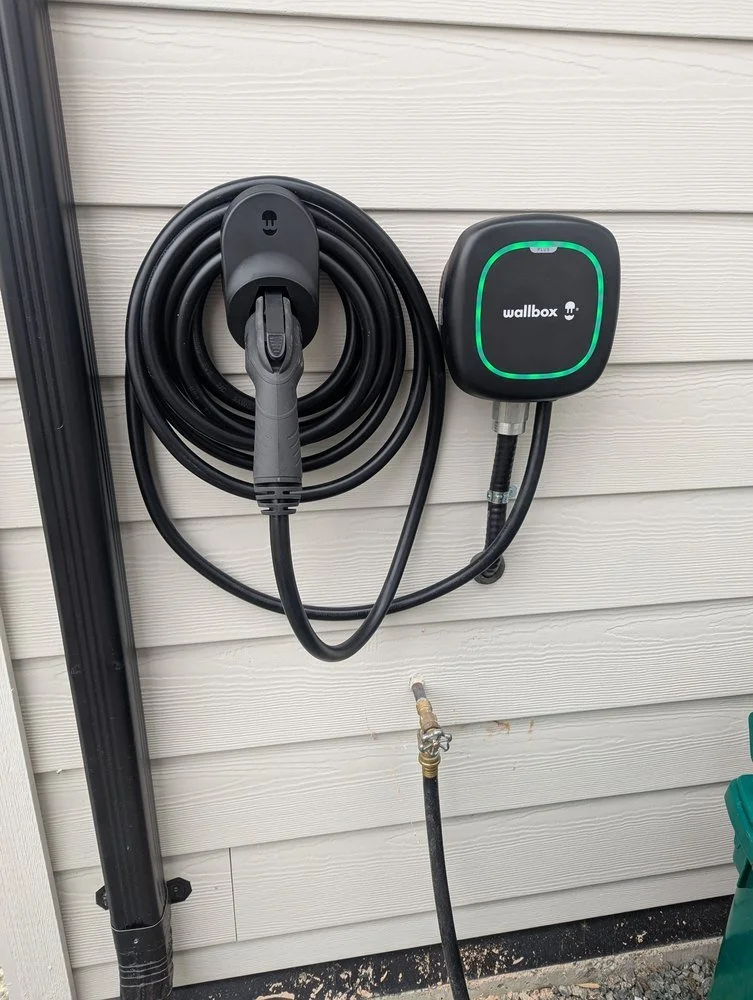 Wallbox EV charger installed on the exterior wall of a home